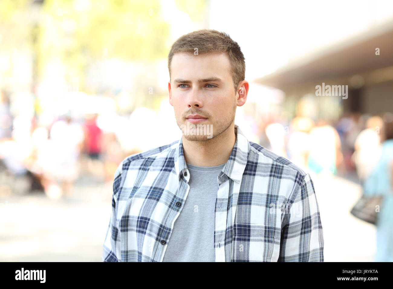 Portrait of a distracted man walking erratic on the street Stock Photo