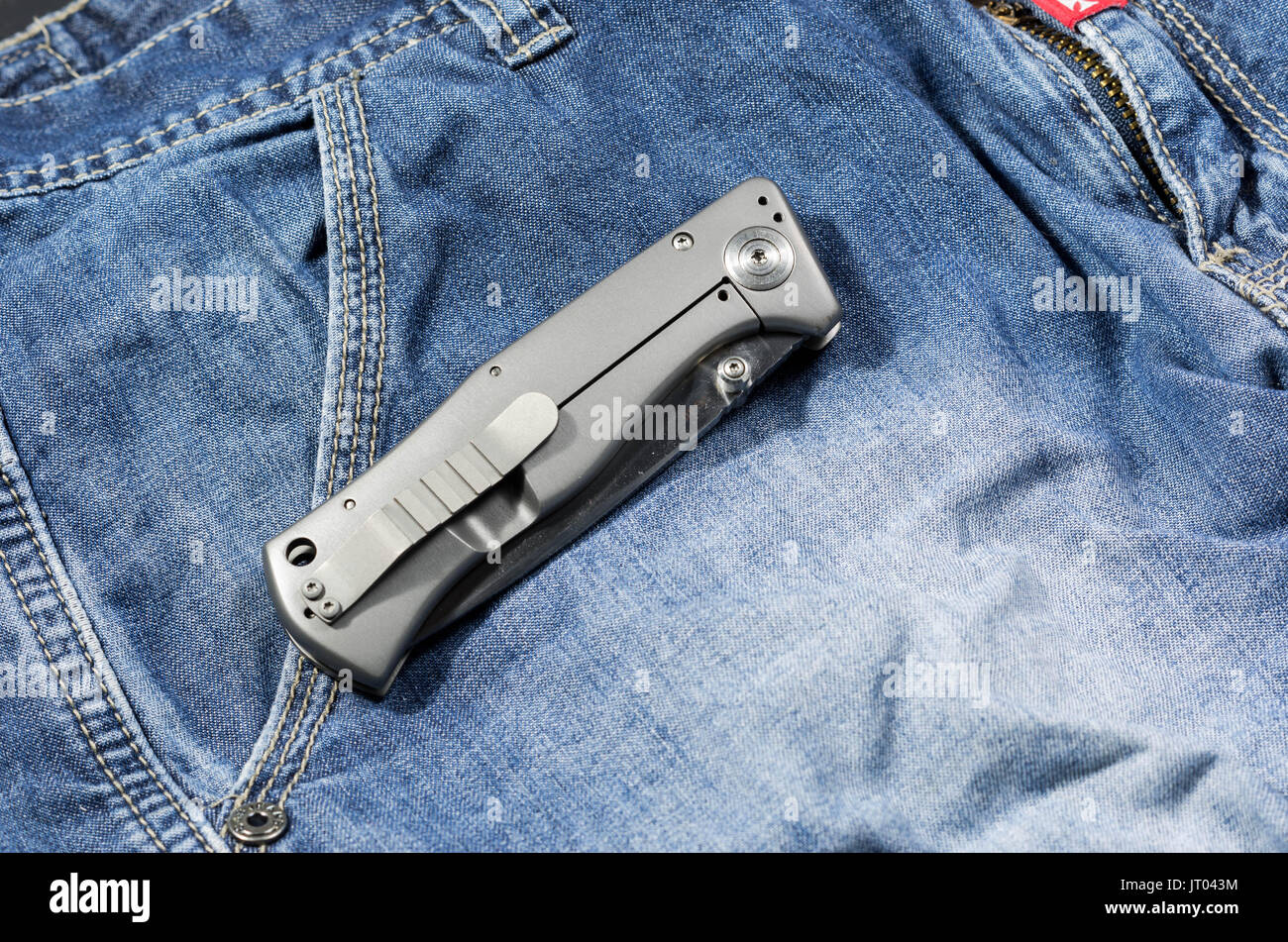 Folding knife with an aluminum handle in the folded form. Back side