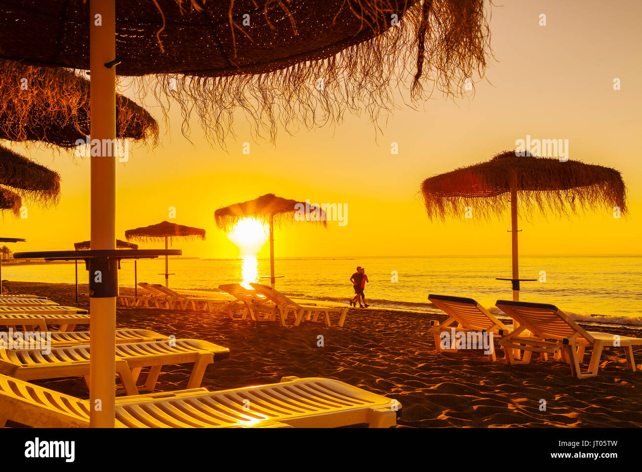 Beach hammocks at sunrise, Benalmadena. Malaga province Costa del Sol. Andalusia Southern Spain, Europe Stock Photo