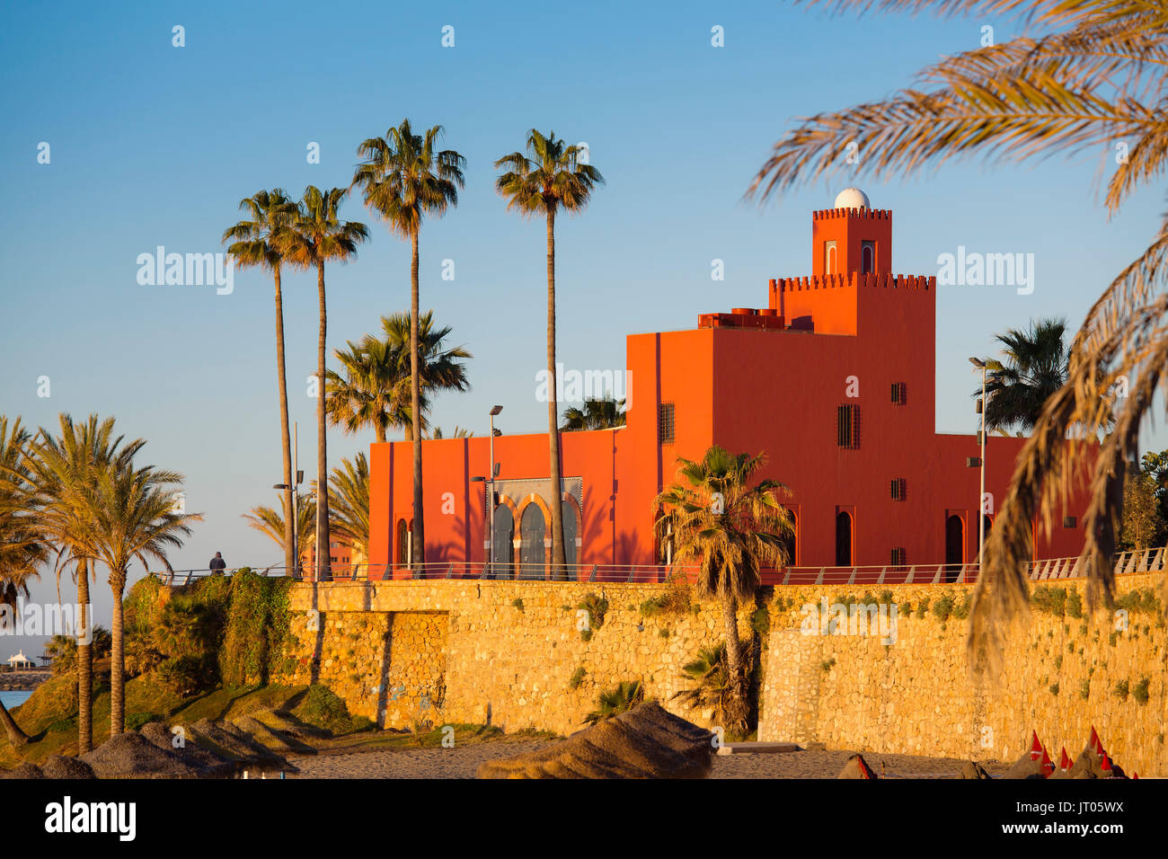 Beach at sunrise. Bil-Bil castle built in neo-Arab style in 1934, Benalmadena. Malaga province Costa del Sol. Andalusia Southern Spain, Europe Stock Photo