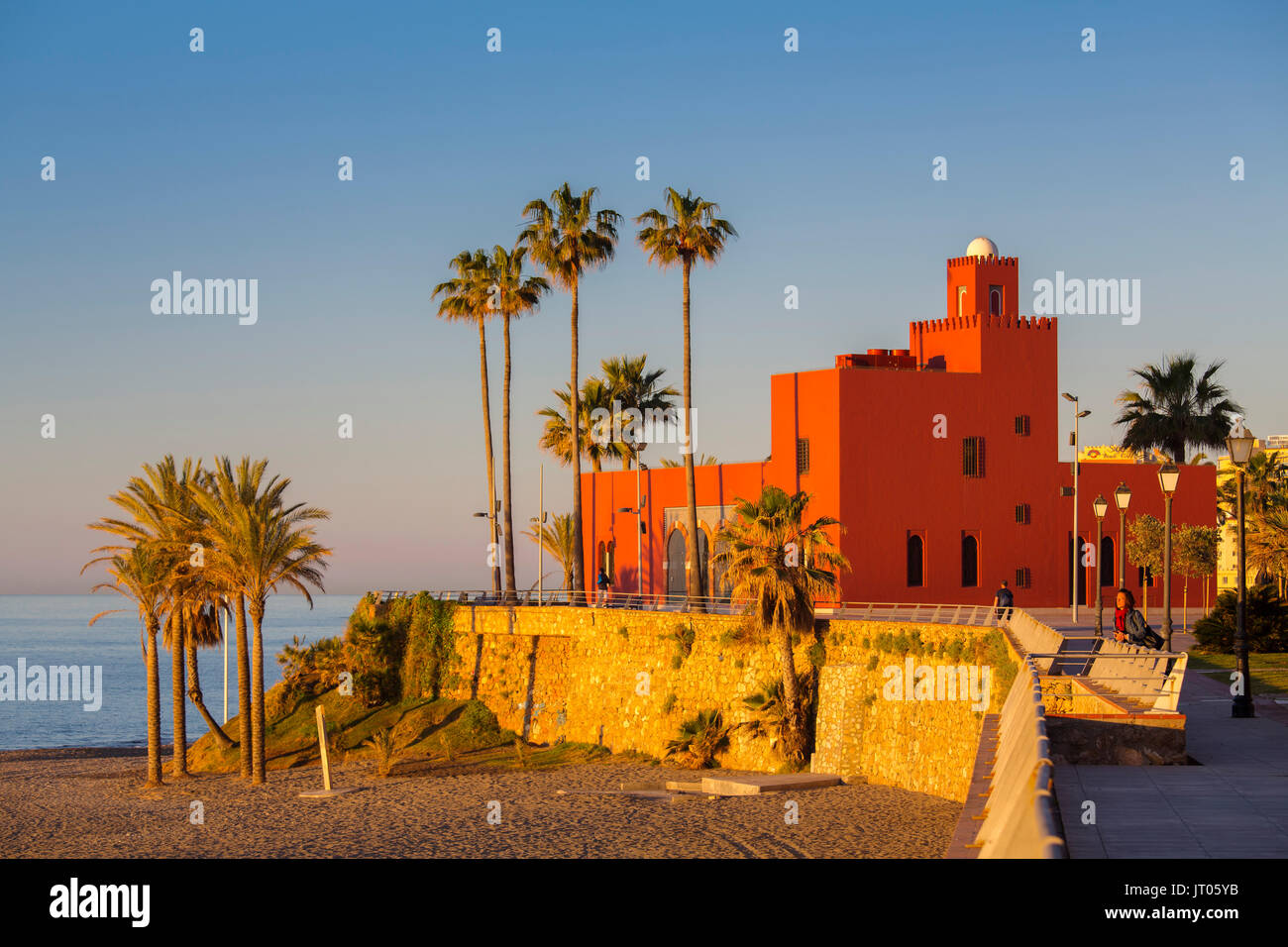 Beach at sunrise. Bil-Bil castle built in neo-Arab style in 1934, Benalmadena. Malaga province Costa del Sol. Andalusia Southern Spain, Europe Stock Photo