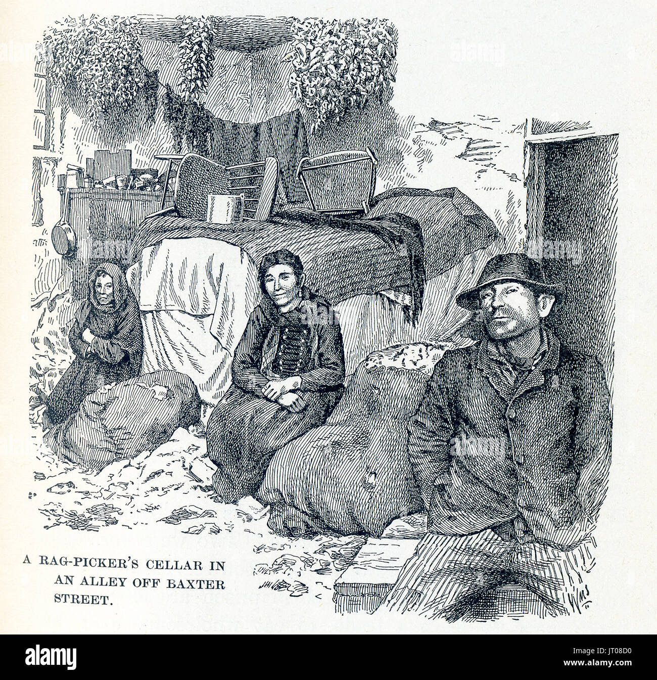 This late 19th-century illustration shows a rag picker's cellar in an alley off Baxter Street in New York City. It is near the Water Street Mission. In 1872 businessman Frederick Hatch bought the property in Lower Manhattan that became the Water Street Mission. He had met Jerry McAuley and put him in charge of this new venture - America's first Rescue Mission. Stock Photo