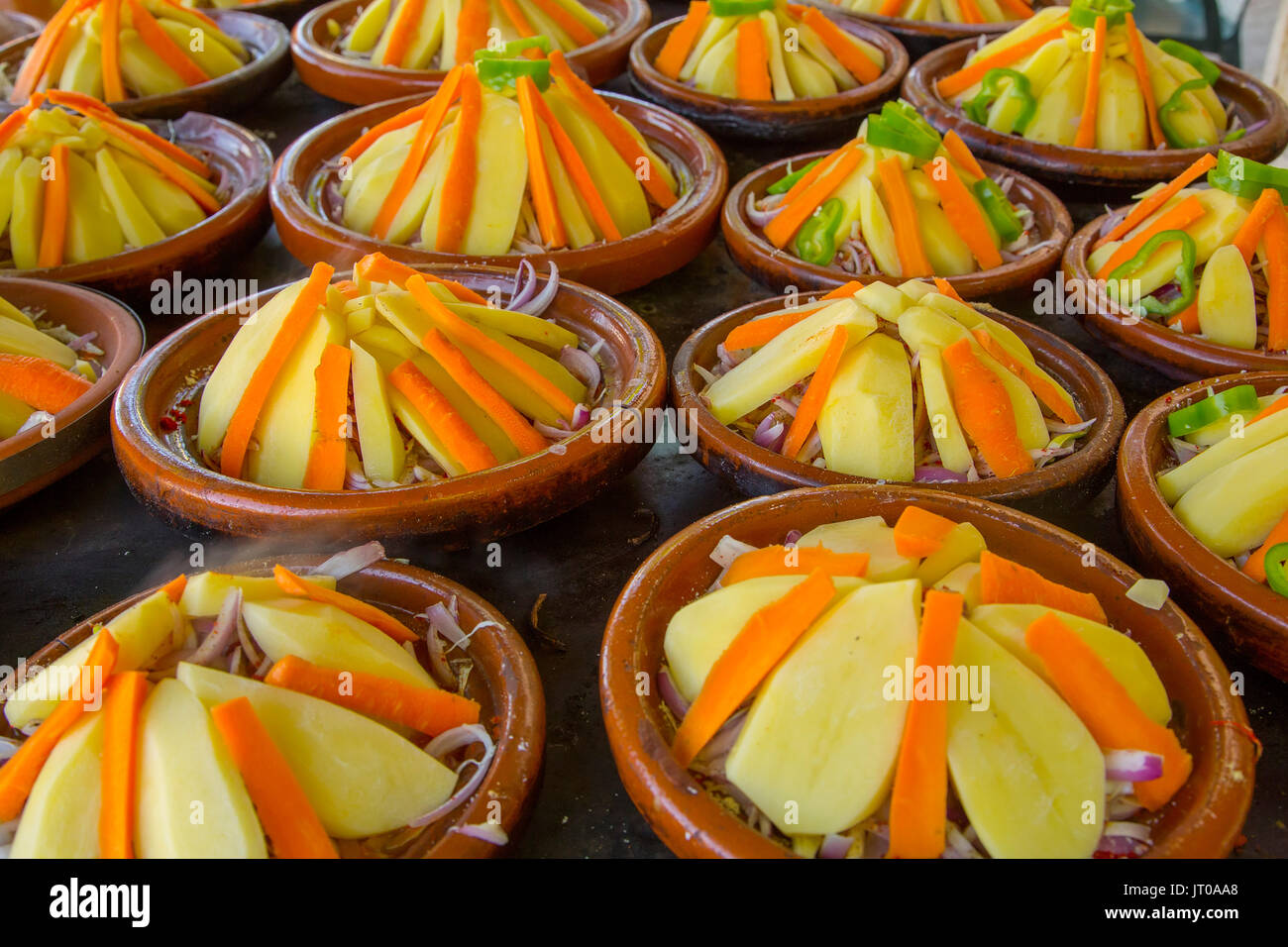 Cooking traditional Moroccan tajine dish, meat and vegetables. Morocco, Maghreb North Africa
