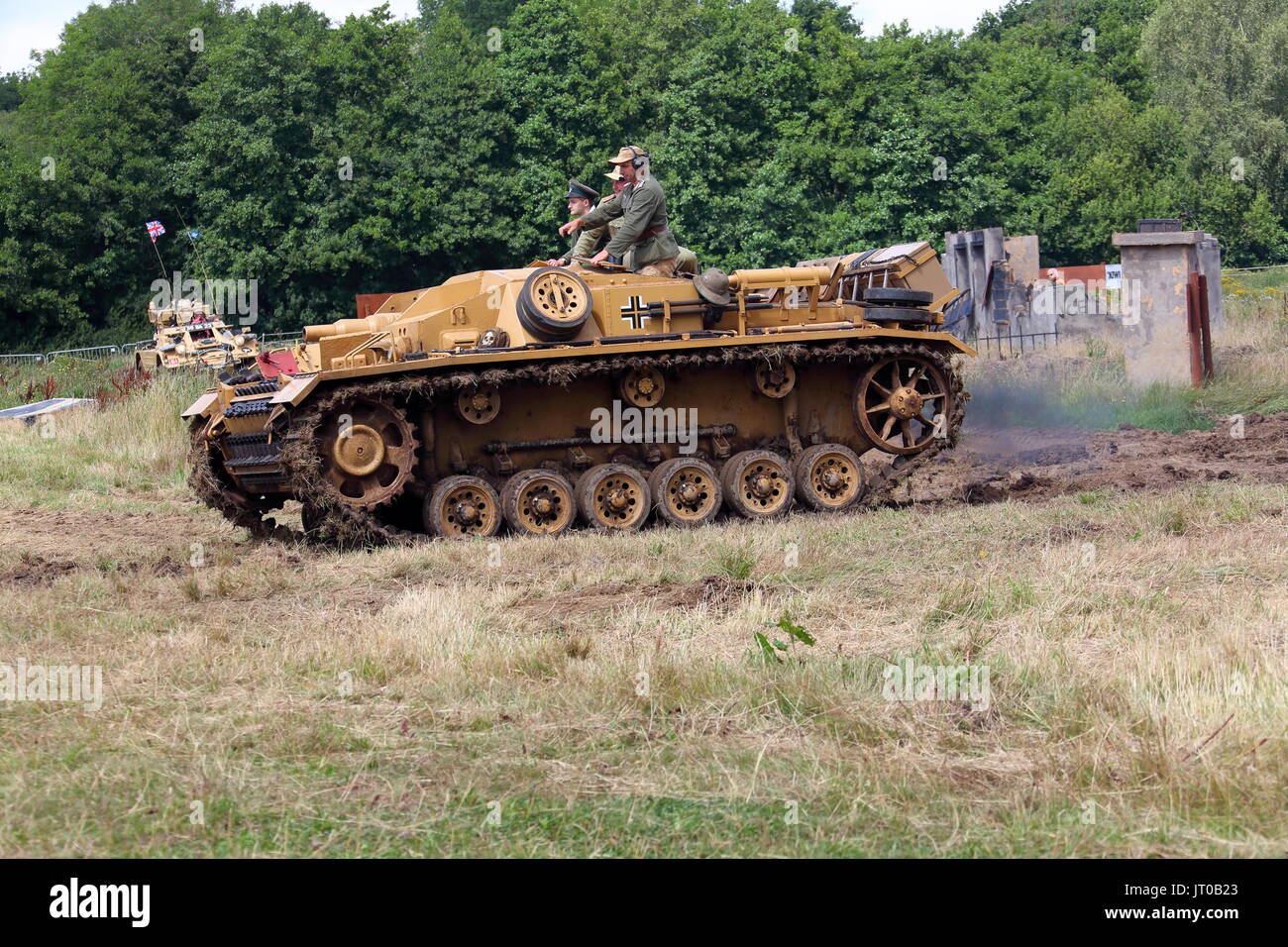 A second world war German tracked vehicle lovingly restored to its former glory and being run around an arena on a public display at Beltring in Kent. Stock Photo