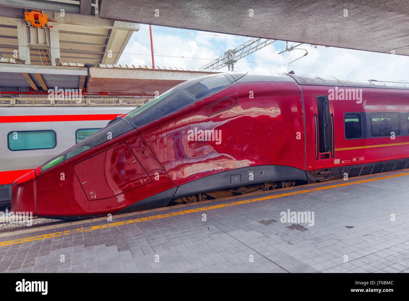 Modern highspeed passenger train stand on the railways station Stock