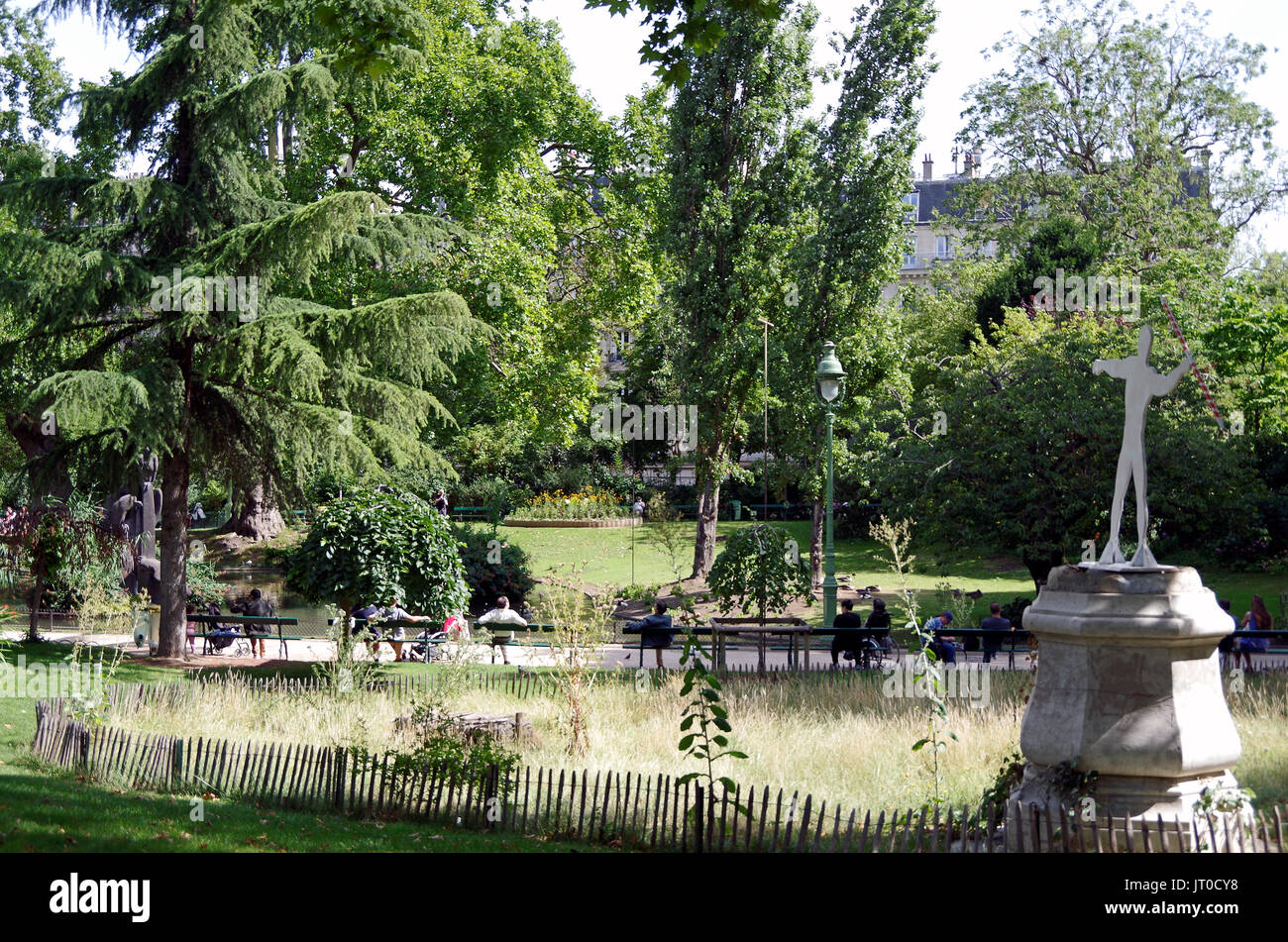 Square des Batignolles, Paris France, the landscaping, lawns, pond, lake and paths of this small but beautiful, Parisian neighborhood park, Stock Photo
