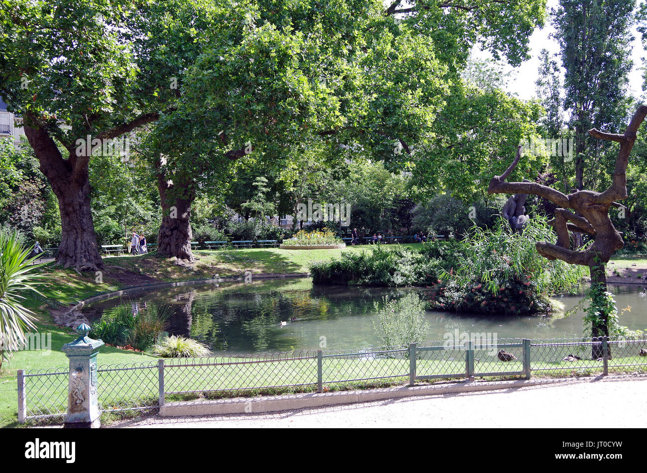 Square des Batignolles, Paris France, the landscaping, lawns, pond, lake and paths of this small but beautiful, Parisian neighborhood park, Stock Photo