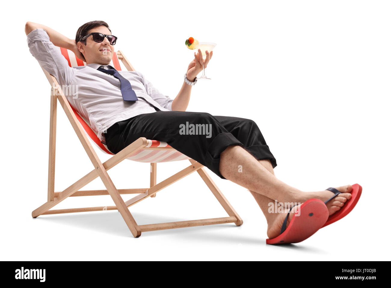 Businessman with a cocktail relaxing in a deck chair isolated on white background Stock Photo