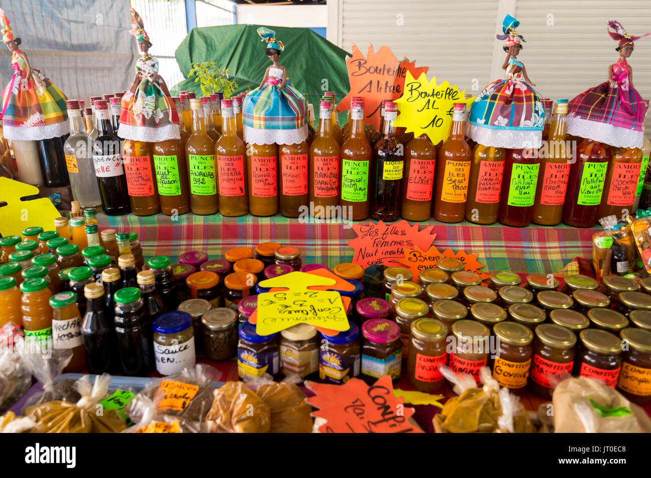 Traditional flavored rum bottles at the market in Martinique, Caribbean. Stock Photo