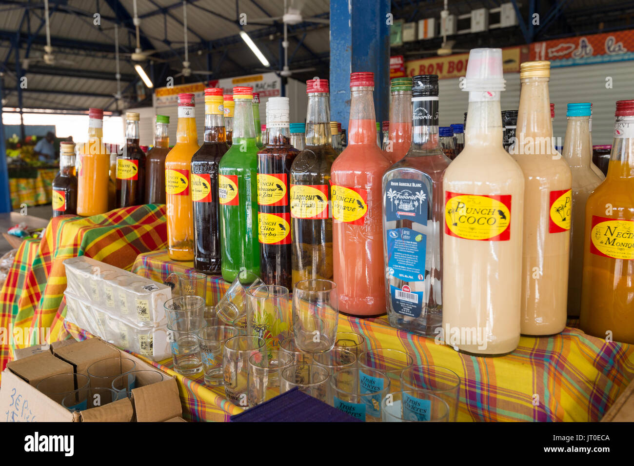 Traditional flavored rum bottles at the market in Martinique, Caribbean. Stock Photo