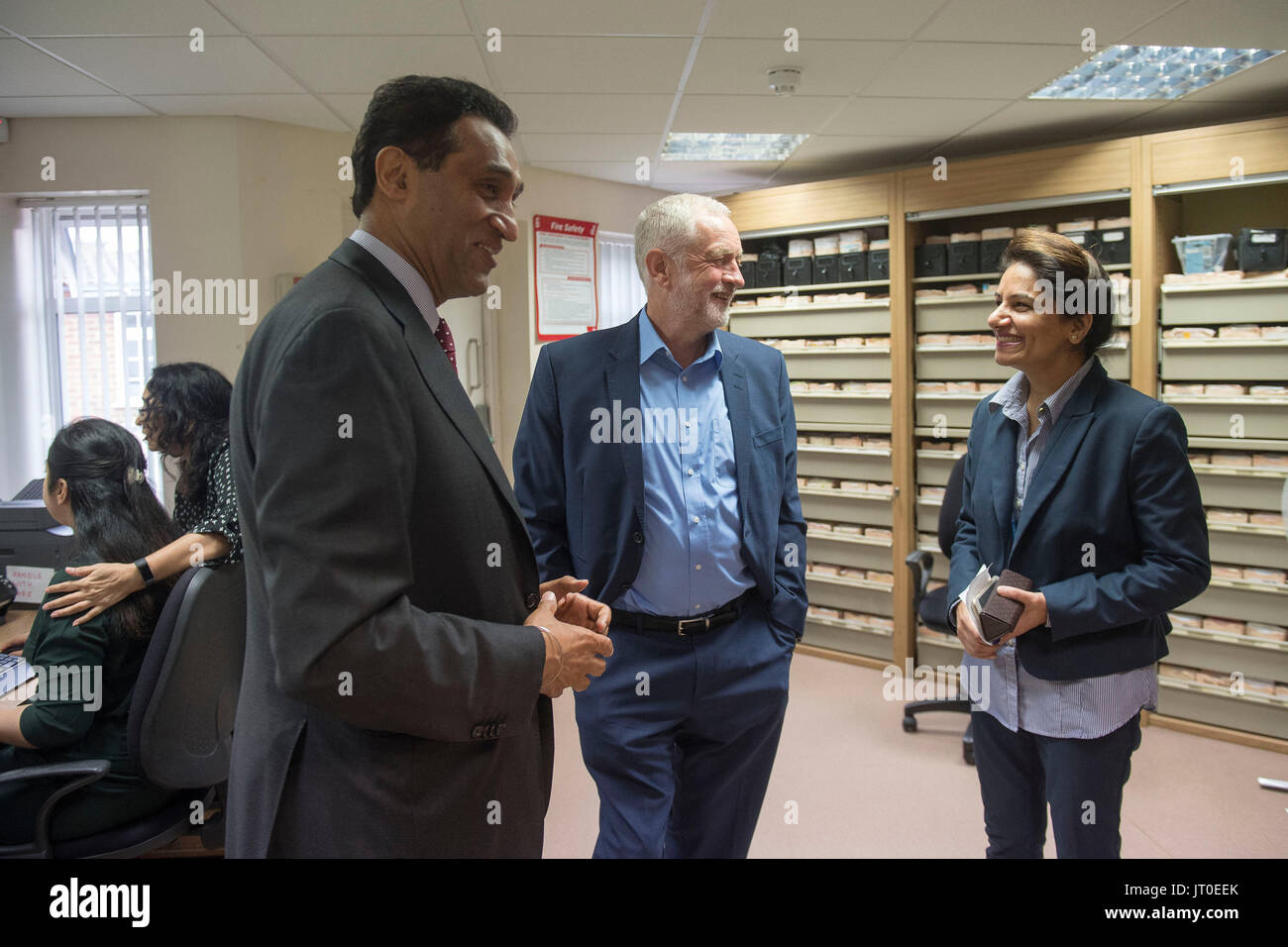 Labour leader Jeremy Corbyn speaks to Dr Onkar Sahota AM (left) and trainee phlebotomists during a visit to Somerset Family Health Practice in Southall, London. Stock Photo