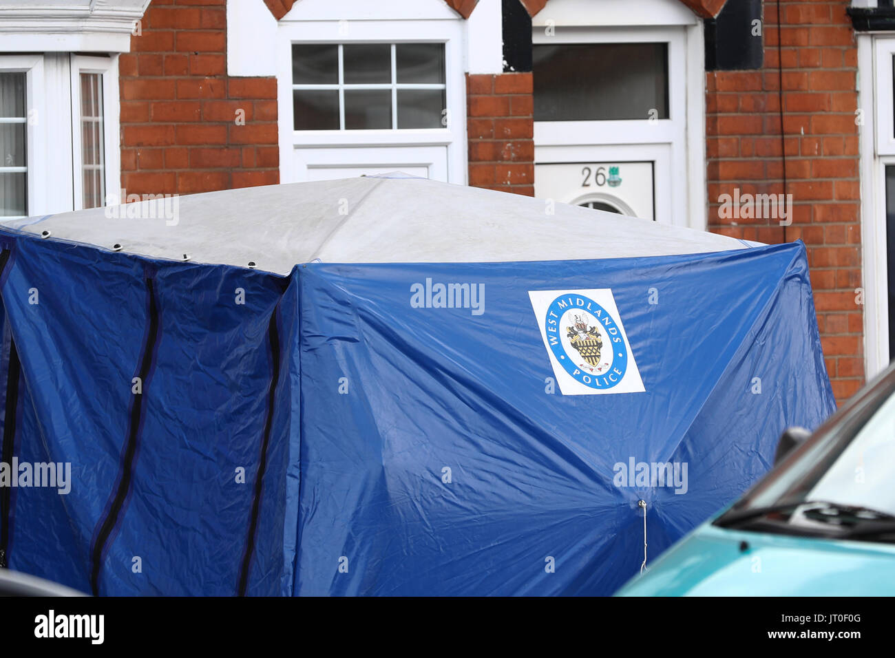 Forensics on Tenby Road in Moseley, Birmingham, where a 40-year-old man has been stabbed to death in what police are calling a 'brutal attack'. Stock Photo