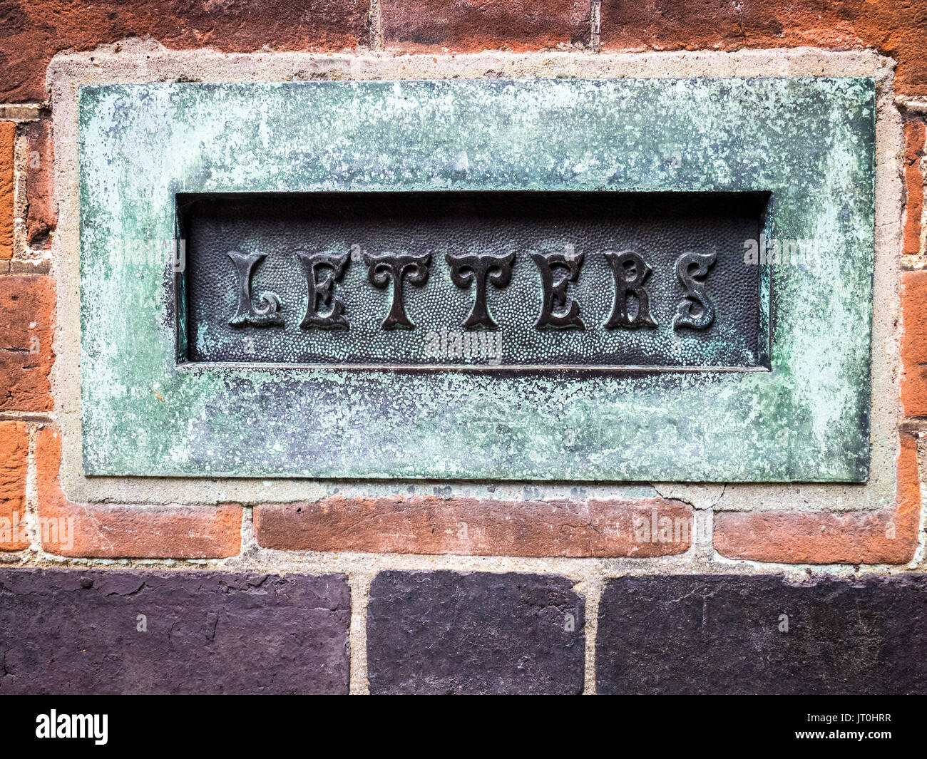 A vintage letter box on a building in Cambridge UK Stock Photo
