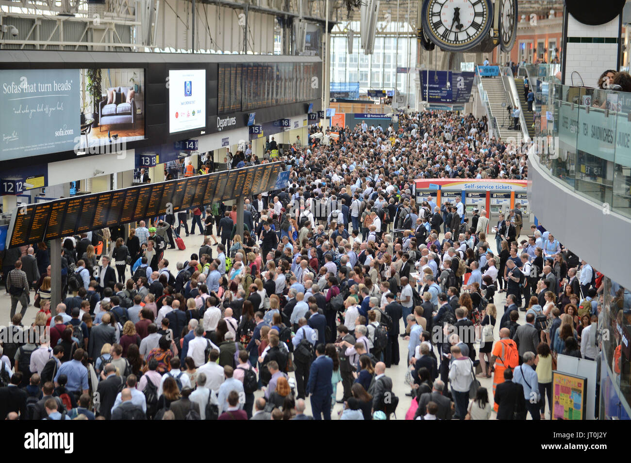 Passengers and commuters at Waterloo Station in London as engineering work continues in a major overhaul of the travel hub. Stock Photo
