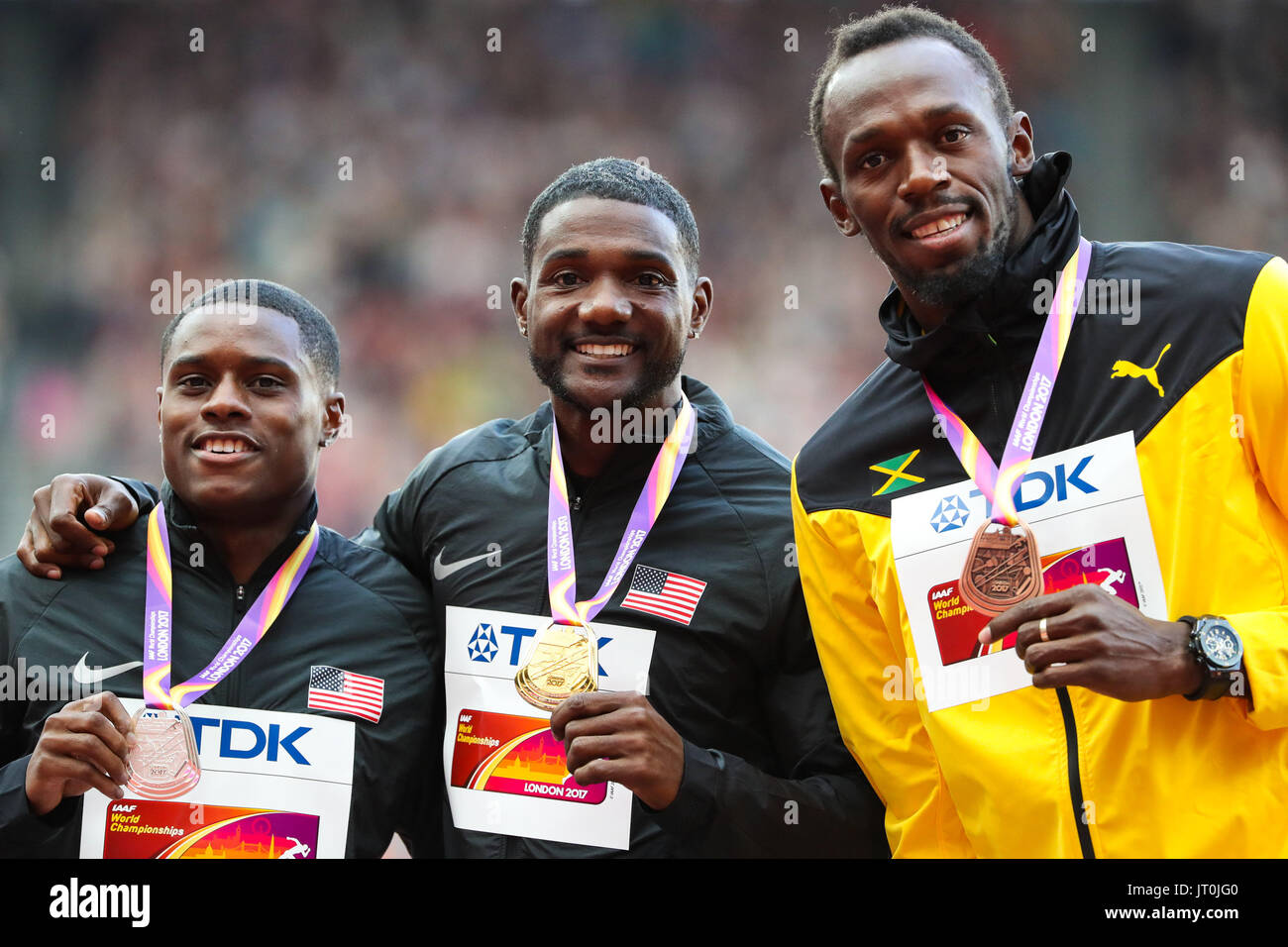 London, 2017 August 06. Men's 100m medalists Christian Coleman (silver), Justin Gatlin (gold) and Usain Bolt (bronze) pose with their medals on the podium on day three of the IAAF London 2017 world Championships at the London Stadium. © Paul Davey. Stock Photo