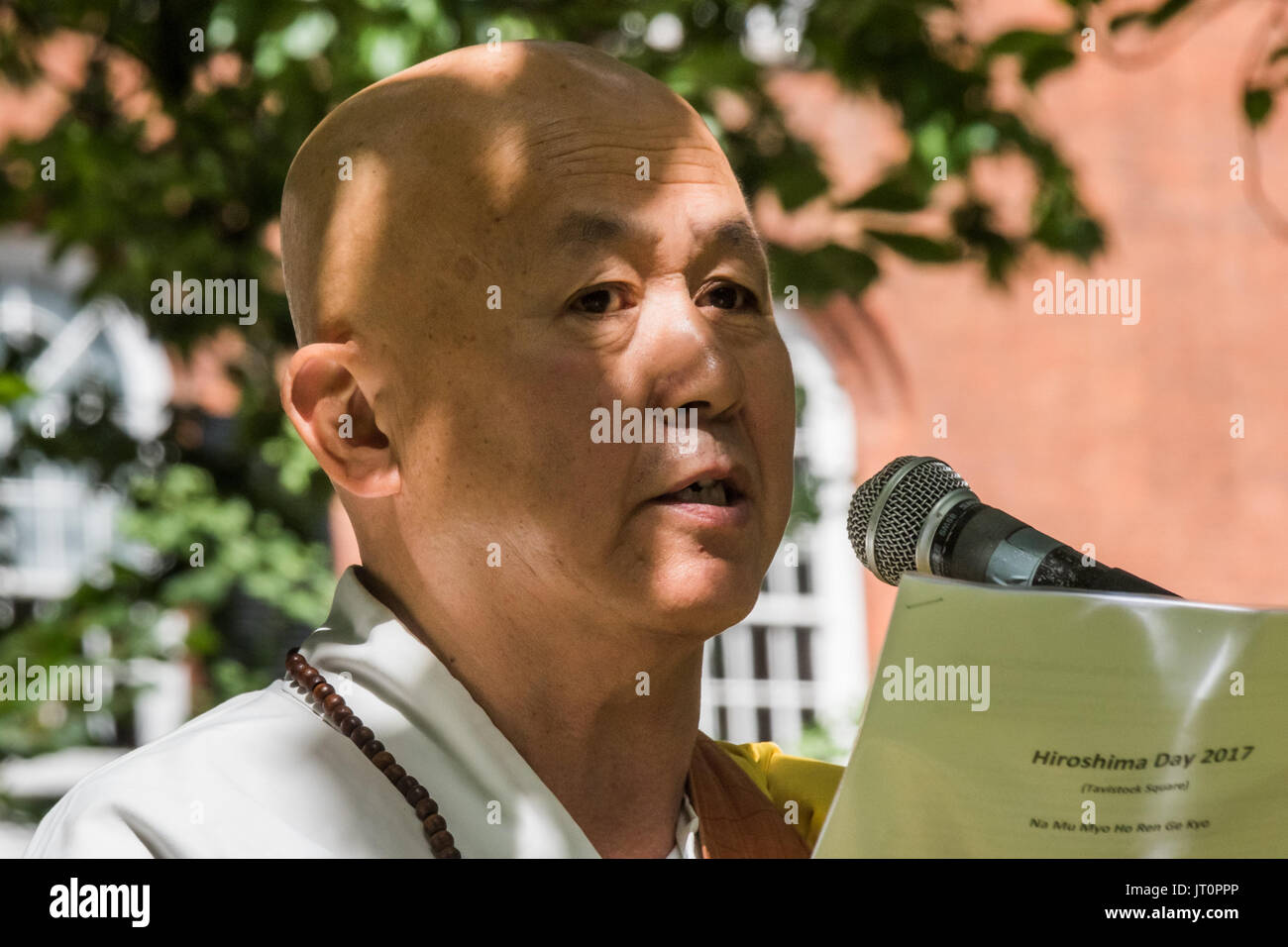 London, UK. 6th Aug, 2017. London, UK. 6th August 2017. Buddhist monk from the Battersea monastery and Peace Pagoda Reverend Gyoro Nagase speaking at the London CND ceremony in memory of the victims, past and present on the 72nd anniversary of the dropping of the atomic bomb on Hiroshima and the second atomic bomb dropped on Nagasaki three days later. After a number of speeches and performances there was a minute's silence during which the Deputy Mayor of Camden and others laid flowers around the commemorative cherry tree. Peter Marshall ImagesLive (Credit Image: © Peter Marshall/ImagesLive Stock Photo
