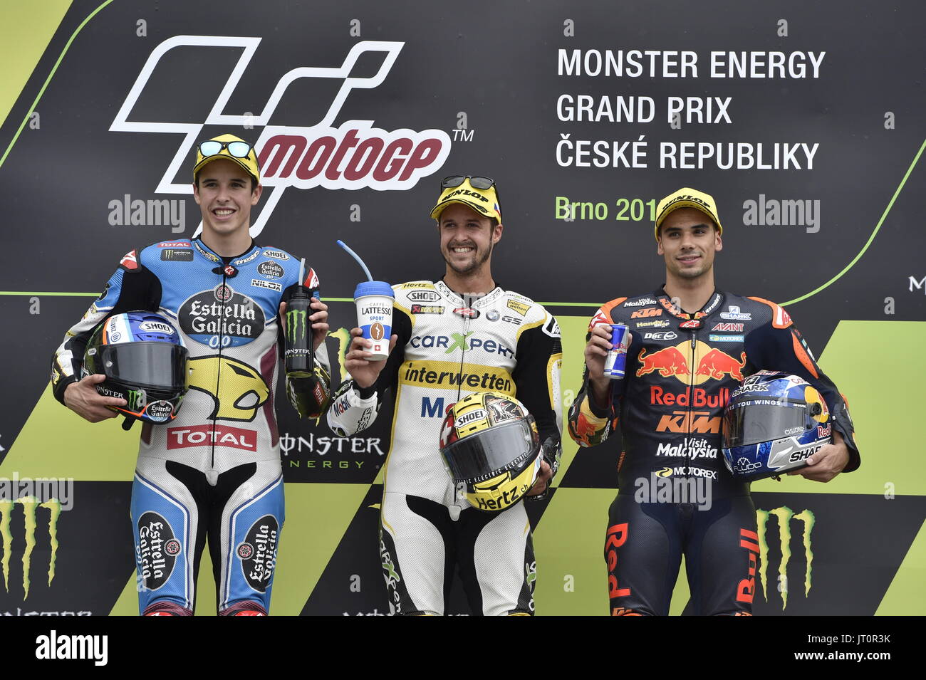 Motorcycle road racers THOMAS LUTHI (center), ALEX MARUEZ (left) and MIGUEL OLIVEIRA are seen on the podium during the Grand Prix of the Czech Republic 2017 on the Brno Circuit in Czech Republic, on August 6, 2017. (CTK Photo/Vaclav Salek) Stock Photo