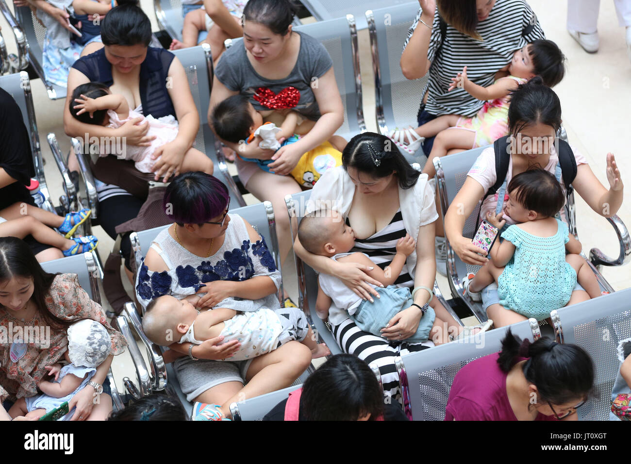 August 5, 2017 - Shenyang, Shenyang, China - Shenyang, CHINA-August 5 2017: (EDITORIAL USE ONLY. CHINA OUT) ..More than 50 women breastfeed their babies during a flash mob activity in Shenyang, northeast China's Liaoning Province, promoting breastfeeding during the World Breastfeeding Week. (Credit Image: © SIPA Asia via ZUMA Wire) Stock Photo