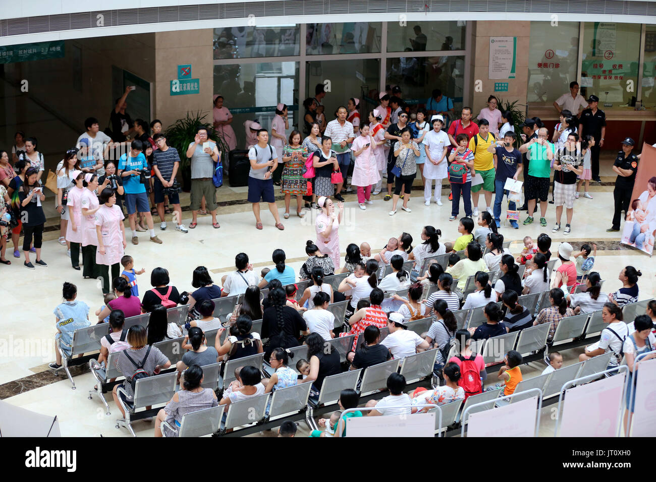 August 5, 2017 - Shenyang, Shenyang, China - Shenyang, CHINA-August 5 2017: (EDITORIAL USE ONLY. CHINA OUT) ..More than 50 women breastfeed their babies during a flash mob activity in Shenyang, northeast China's Liaoning Province, promoting breastfeeding during the World Breastfeeding Week. (Credit Image: © SIPA Asia via ZUMA Wire) Stock Photo