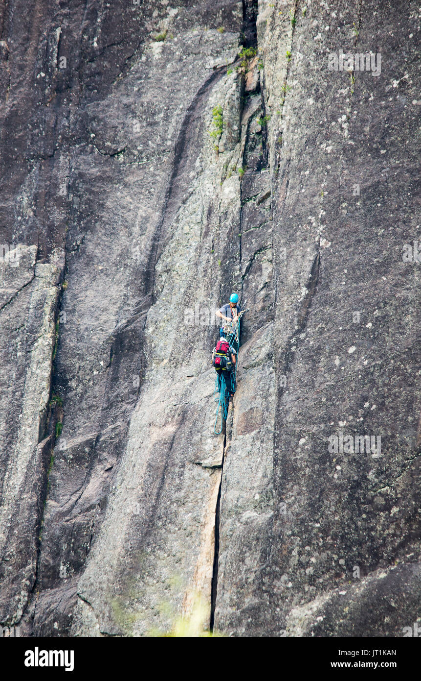 Rock climbers scaling the cliffs of Poke-O-Moonshine mountain New Stock Photo: 152471837 - Alamy