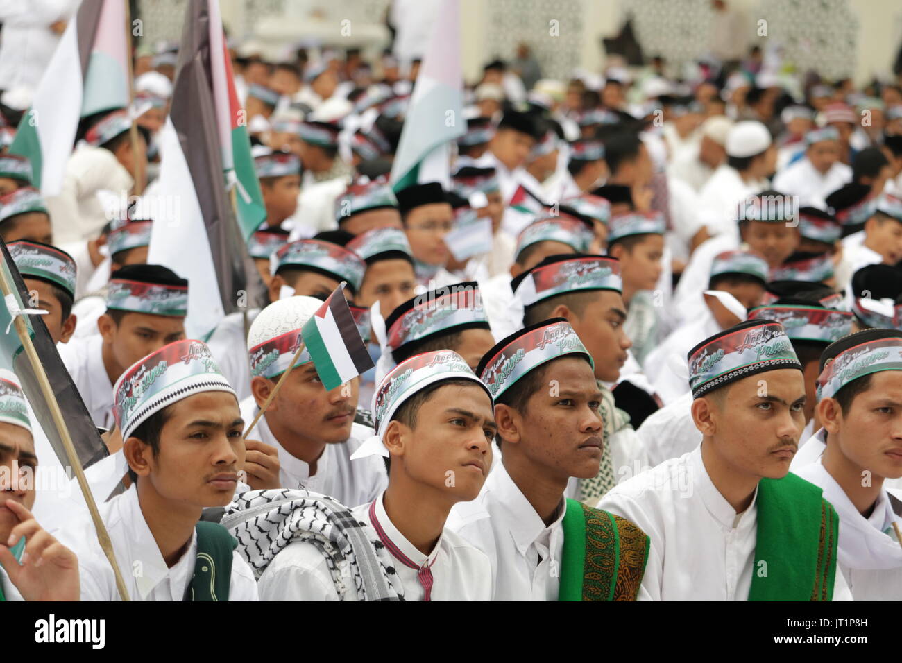 The people of Aceh from various elements are doing solidarity actions for Palestine. In the action centered at Baiturrahman Great Mosque, Banda Aceh City, the participants of the action perform various activities such as recitation, remembrance, prayer, donation, and parade. The people of Aceh from various elements are doing solidarity actions for Palestine. In the action centered at Baiturrahman Grand Mosque, Banda Aceh City, the participants of the action perform various activities such as recitation, remembrance, prayer, donation, and parade. (Photo by Abdul Hadi Firsawan/Pacific Press) Stock Photo