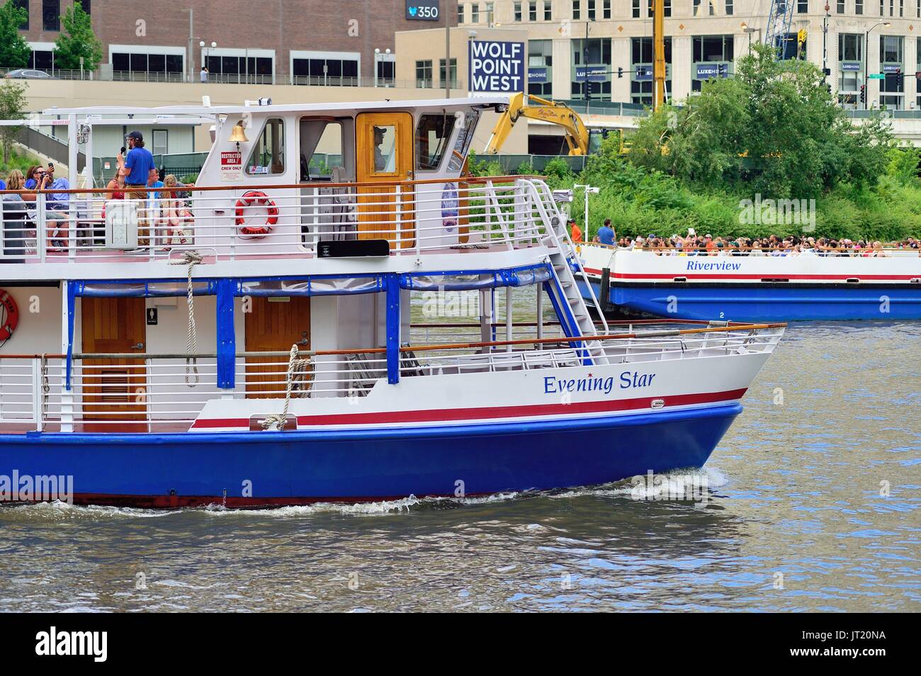 Chicago, Illinois, USA. A pair of tourist boats that provide water taxi and tour duties pass at Wolf Point. Stock Photo