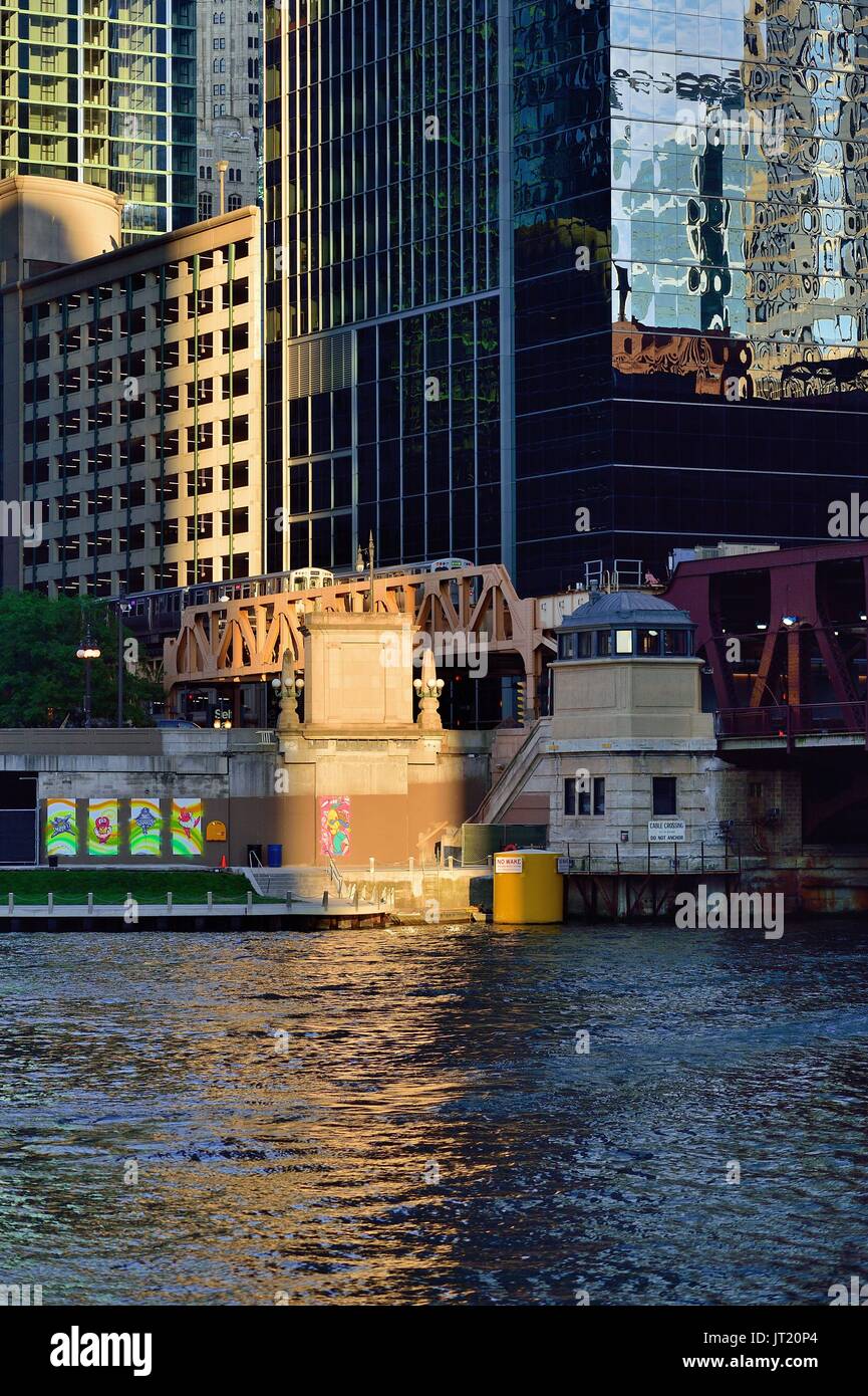 A Chicago CTA Pink Line train pops into a sliver of late afternoon ...