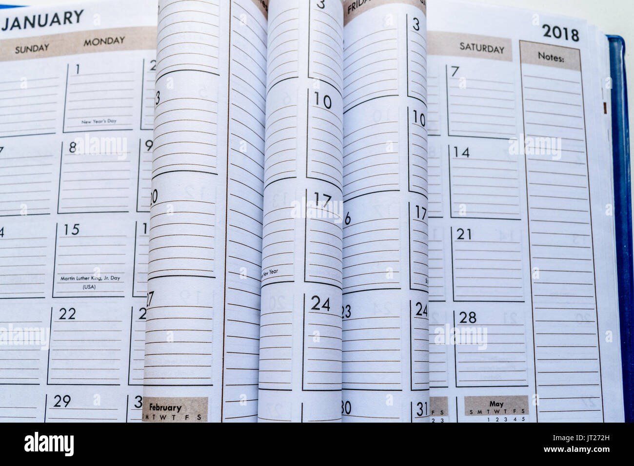 Closeup of 2018 Calendar with folded pages.  Useful for planner and representing a timeline. Stock Photo