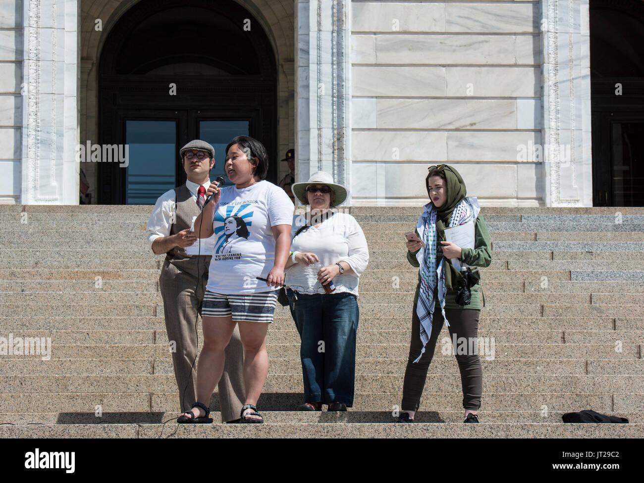 St. Paul, Minnesota.Pro Sharia protesters counterprotesting a rally that is going on inside the capitol which critizes Sharia law. A Jew, Muslim, Asi Stock Photo