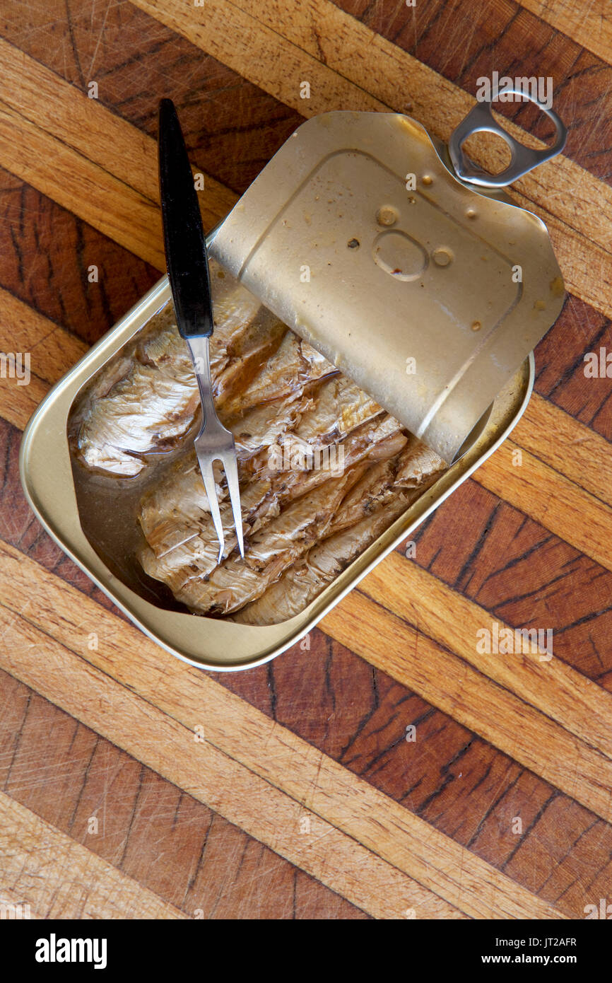 A tin of sardines in mineral spring water with a fork Stock Photo Alamy