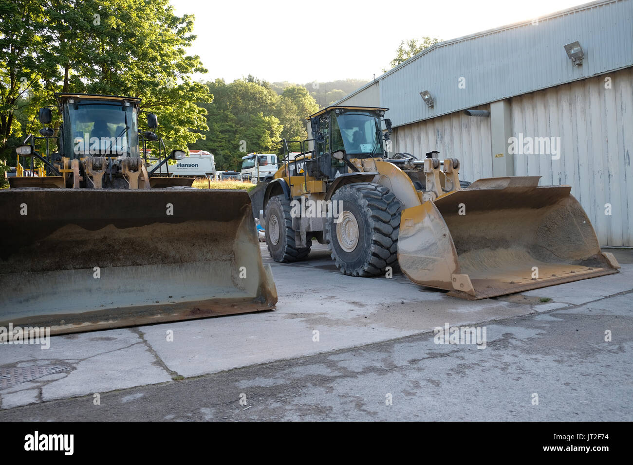 6th August 2017 - Large front end loader shovels parked up at the weekend Stock Photo