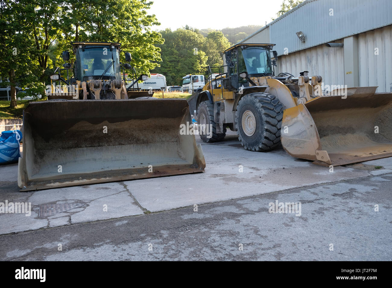 6th August 2017 - Large front end loader shovels parked up at the weekend Stock Photo