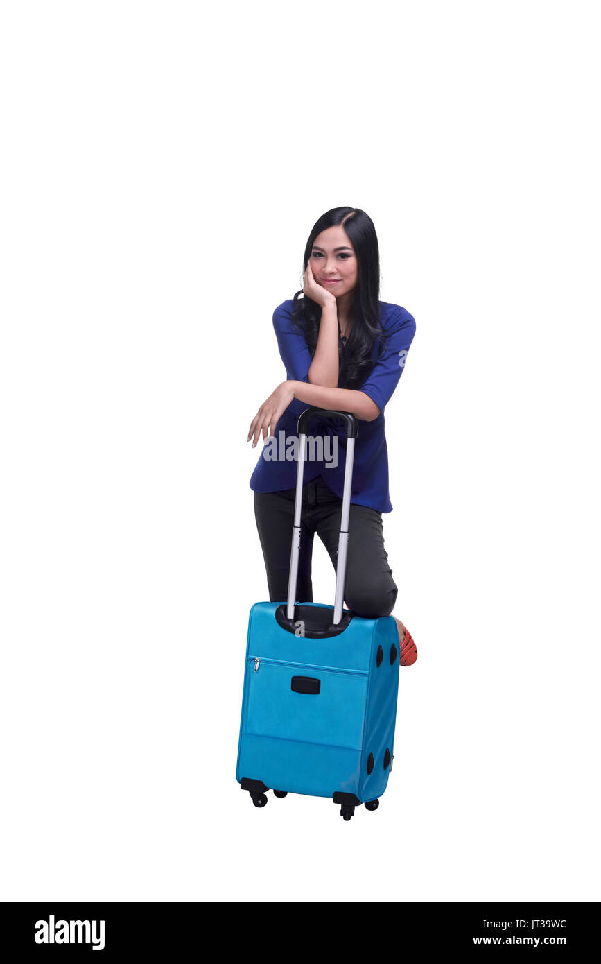 Beautiful asian woman with a suitcase isolated over white background