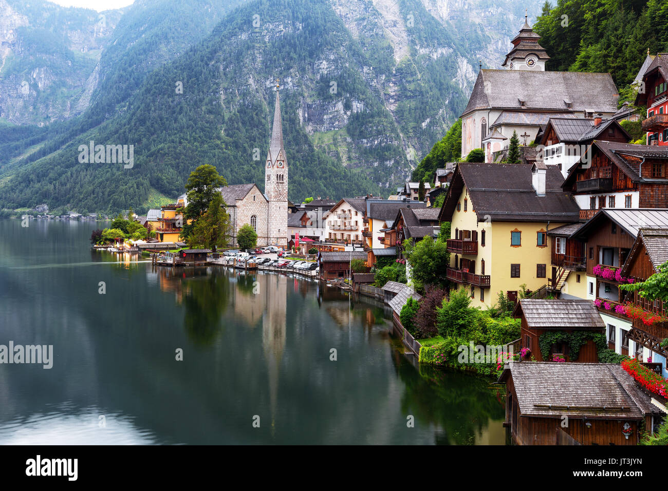 Scenic picture-postcard view of famous historic Hallstatt mountain village with Hallstattersee in the Austrian Alps in mystic twilight during blue hou Stock Photo