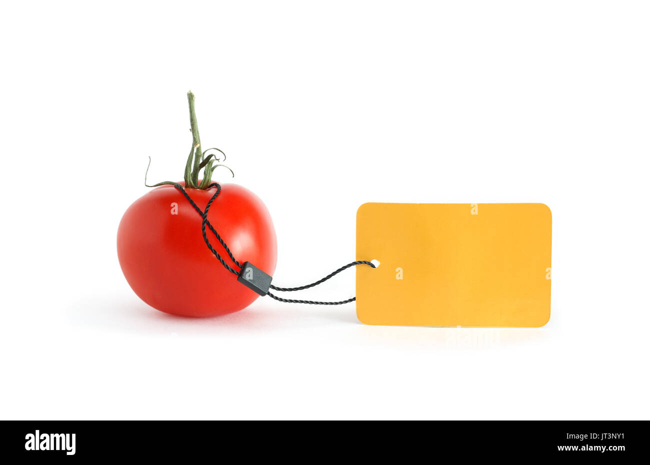 Freshness red tomato with blank yellow paper label on white background Stock Photo
