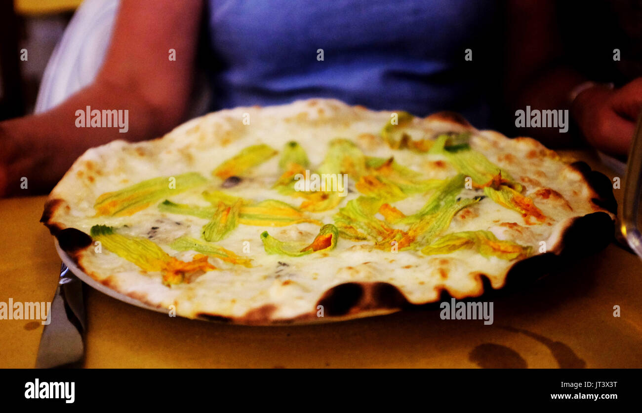 Rome Italy July 2017 Thin pizza with courgette flowers and cheeses in