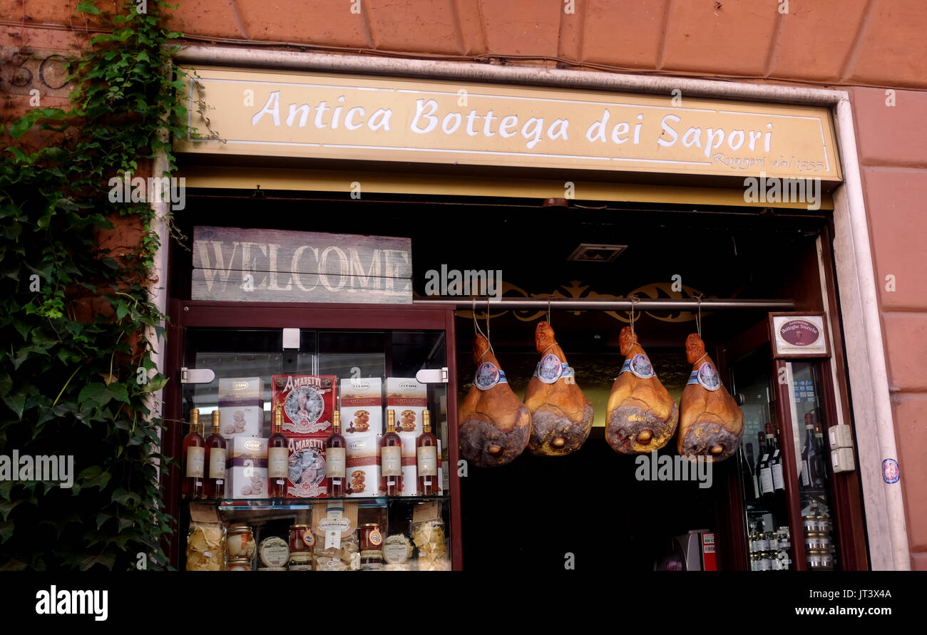 Rome Italy July 2017 - Typical quaint shop in the Centro Storico district selling hams Stock Photo