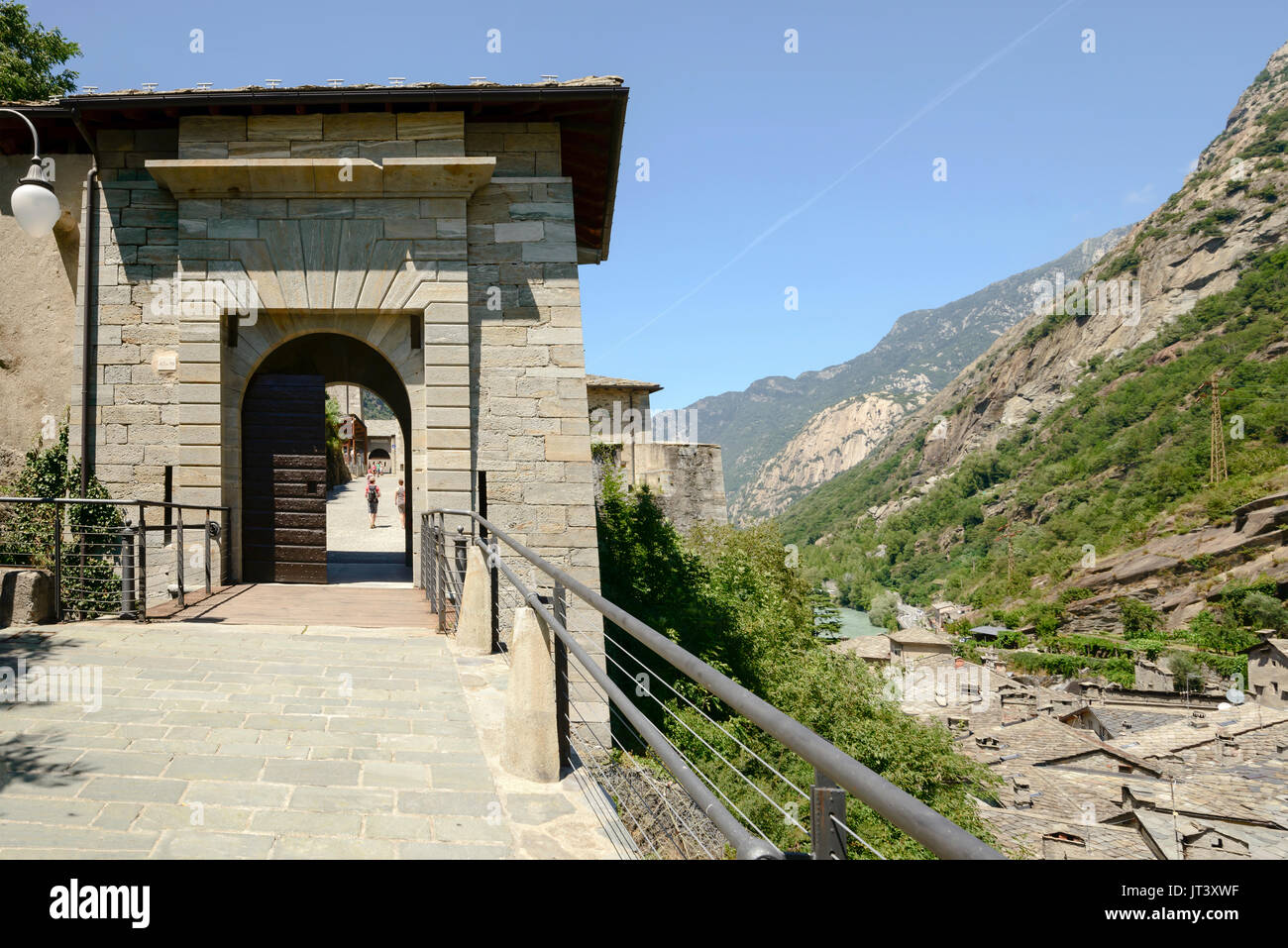 view of fortification entrance at medieval mountain village set in a narrow valley, shot on a bright summer day at Bard, Aosta valley,  Italy Stock Photo