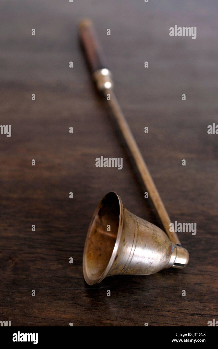Old brass and wood candle snuffer Stock Photo Alamy