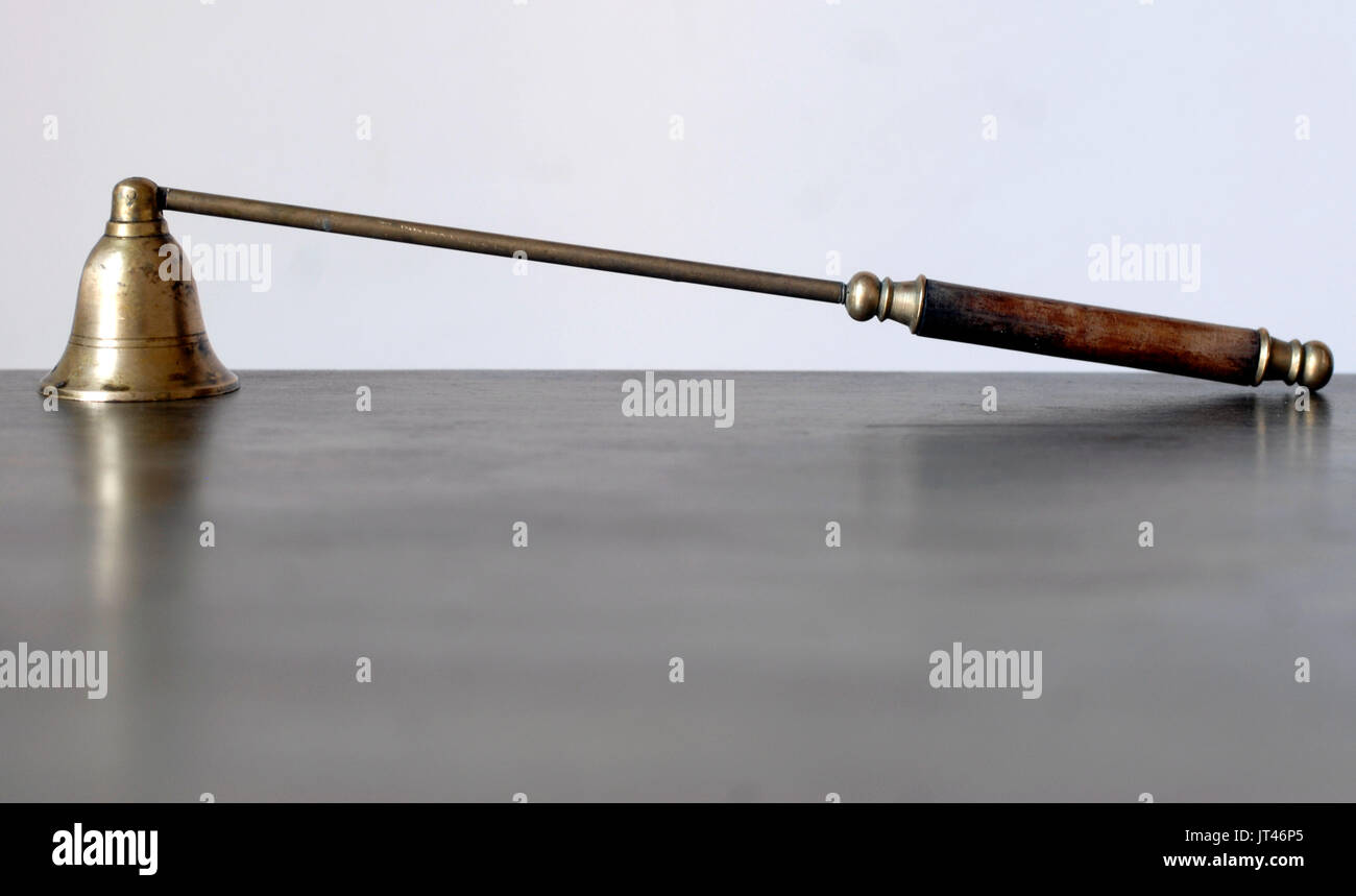 Old brass and wood candle snuffer Stock Photo Alamy