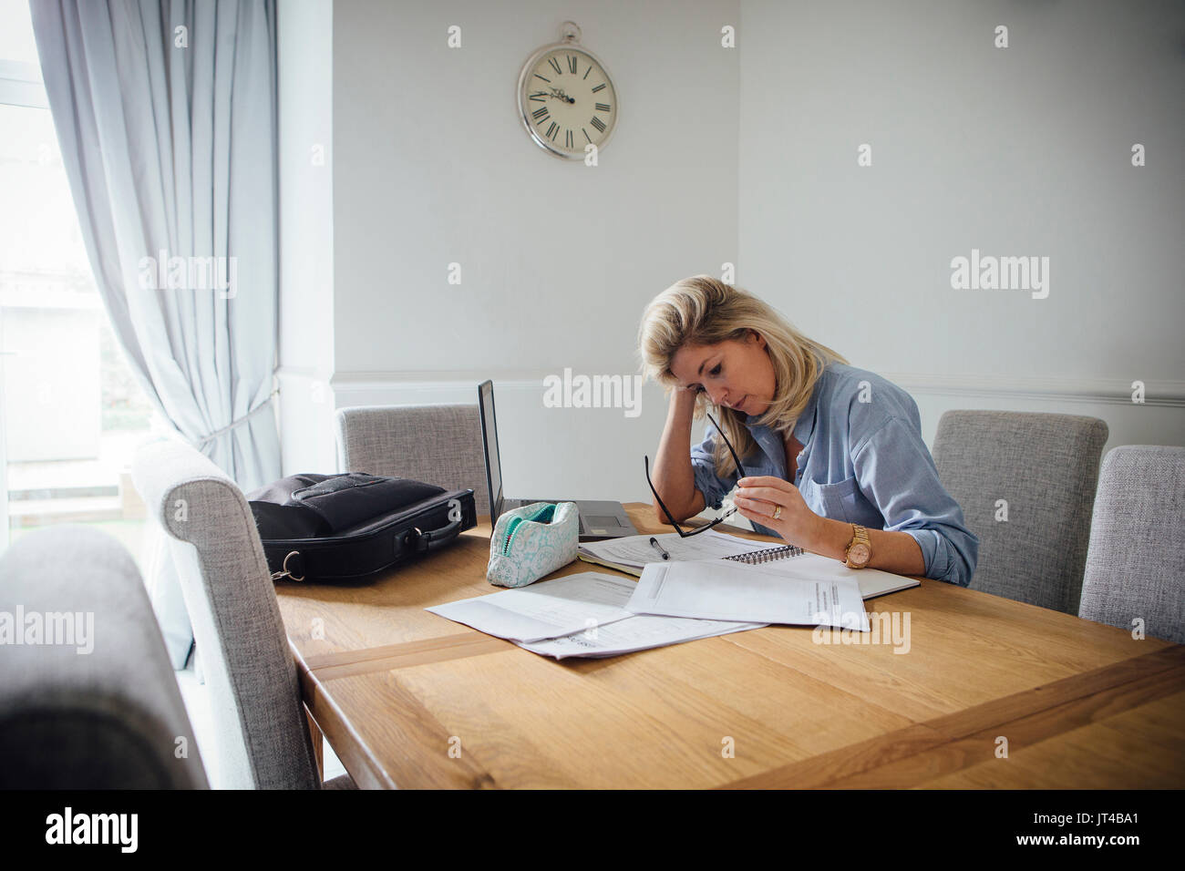 Woman paperwork home mature hi-res stock photography and images - Alamy