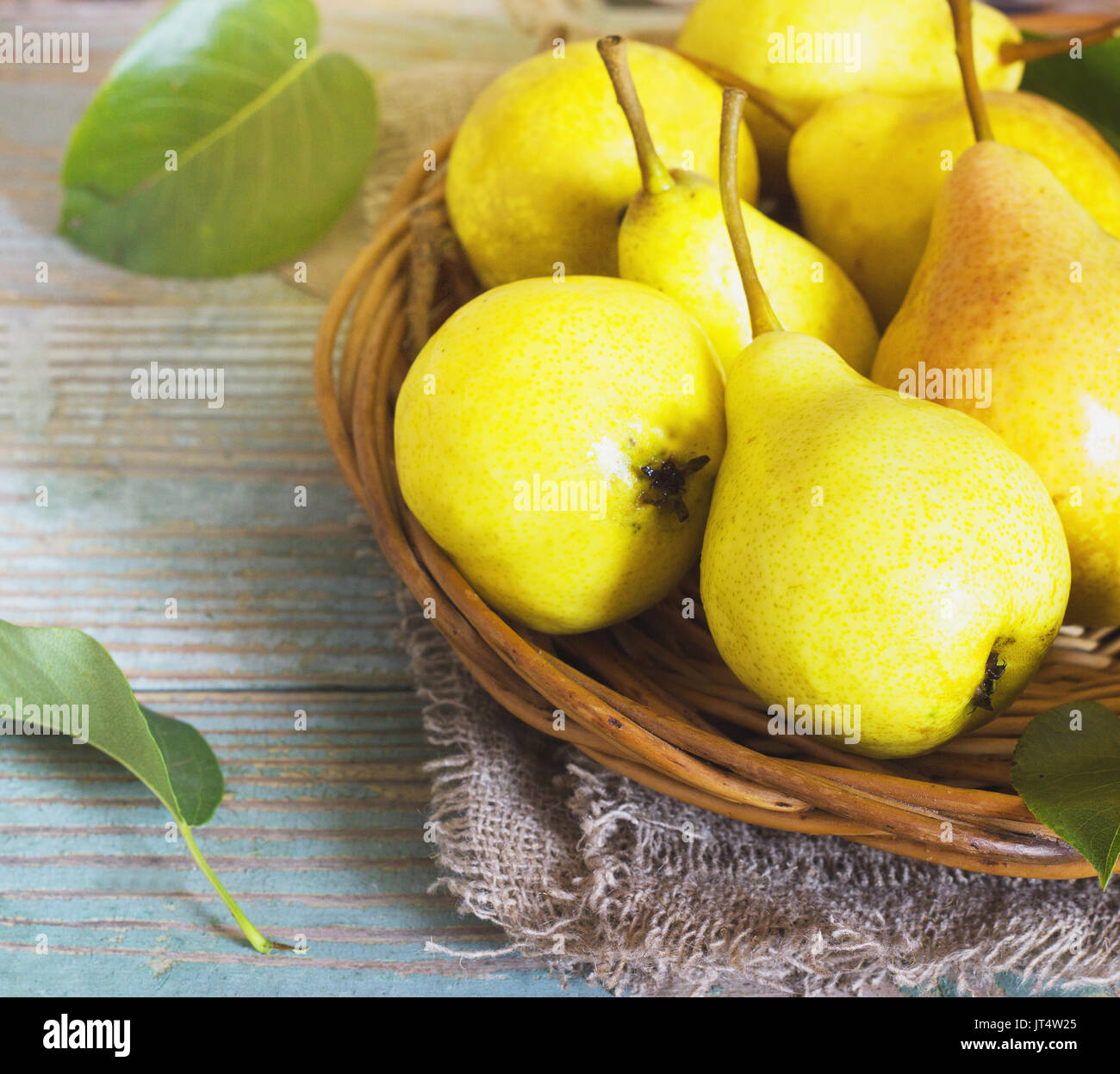 Wicker basket of ripe pears  close up Stock Photo