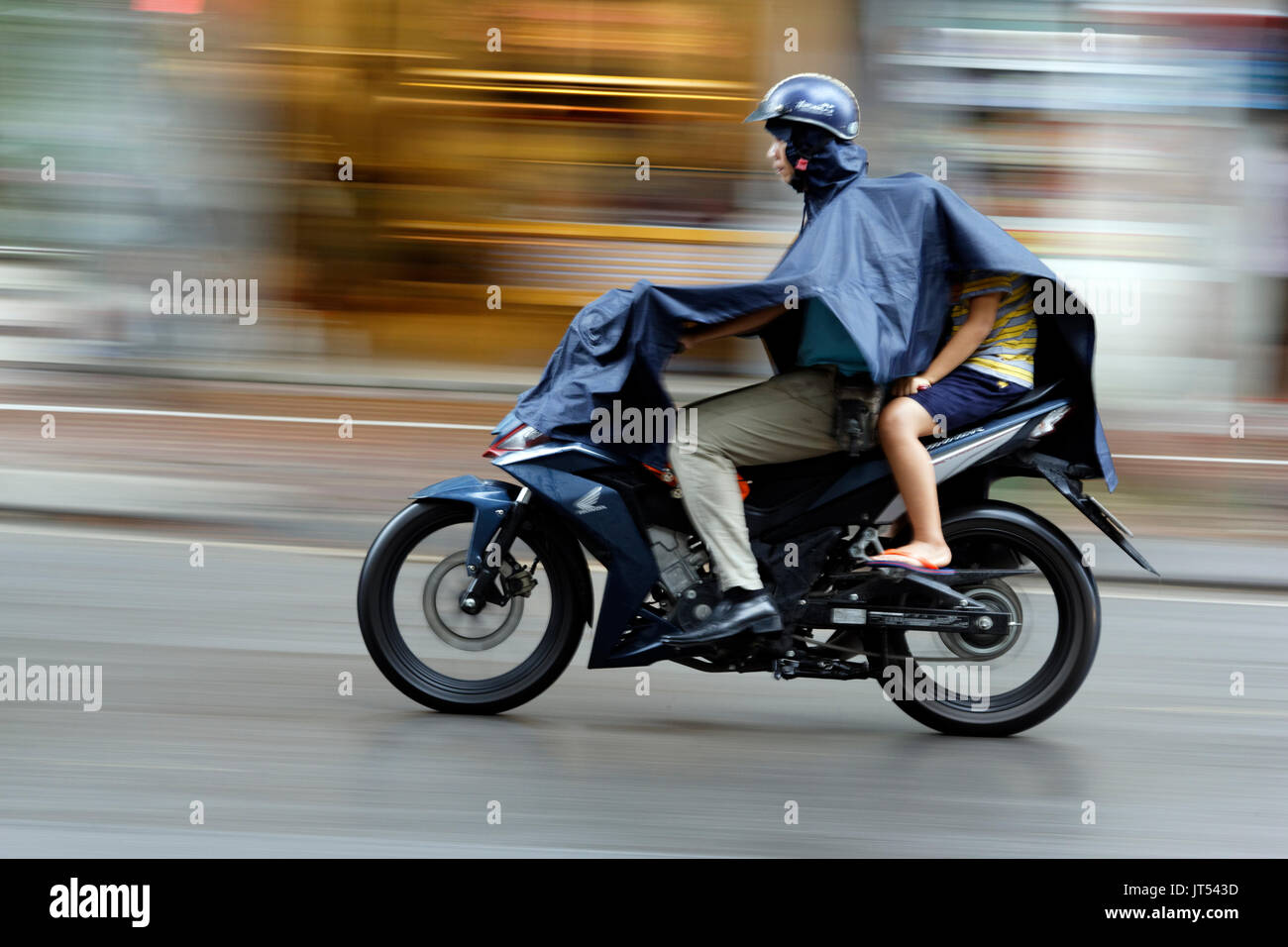 Hanoi Scooter in Rain Stock Photo Alamy