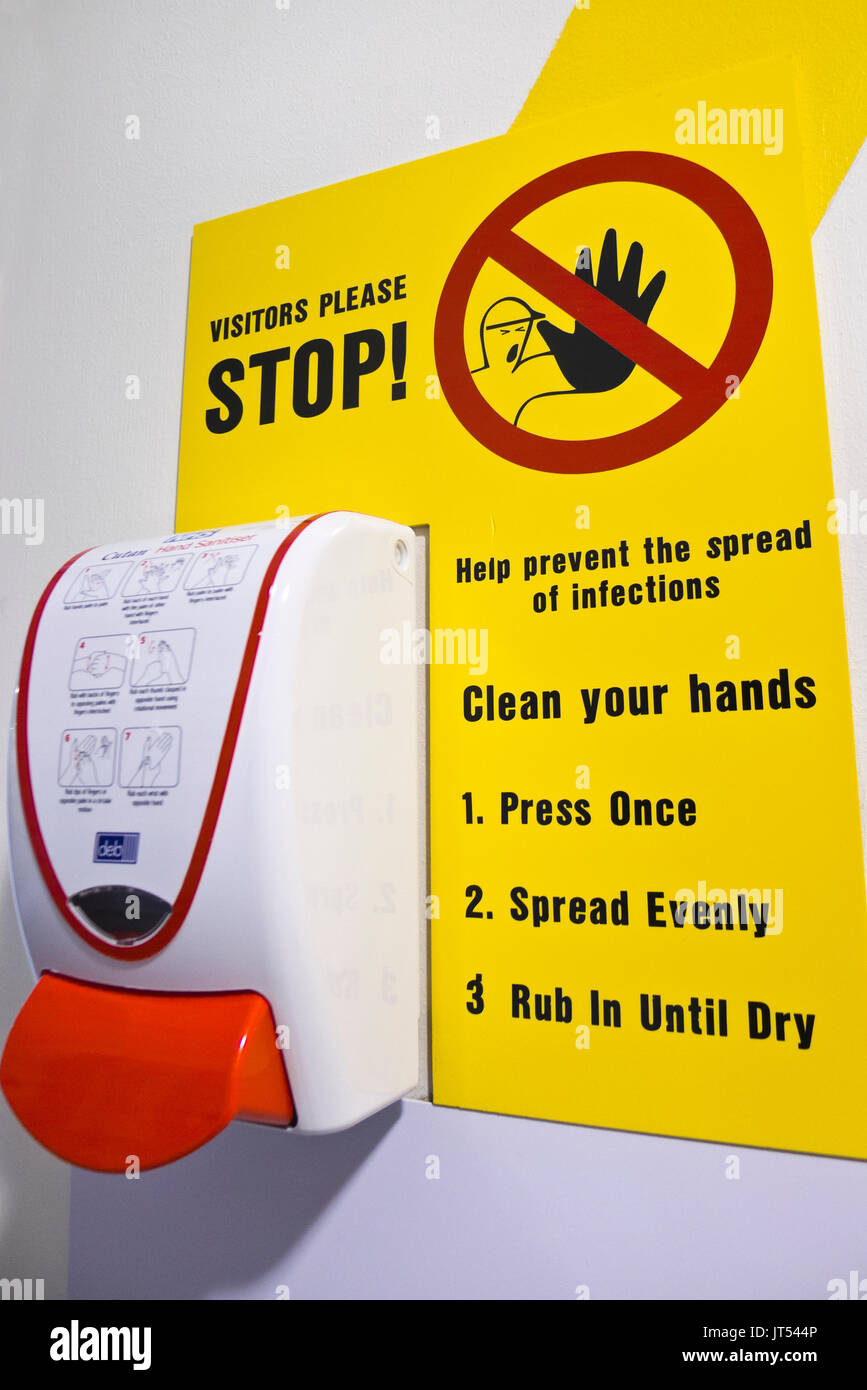 Soap or alcohol hand rub with signage advising action on infection control. Stock Photo