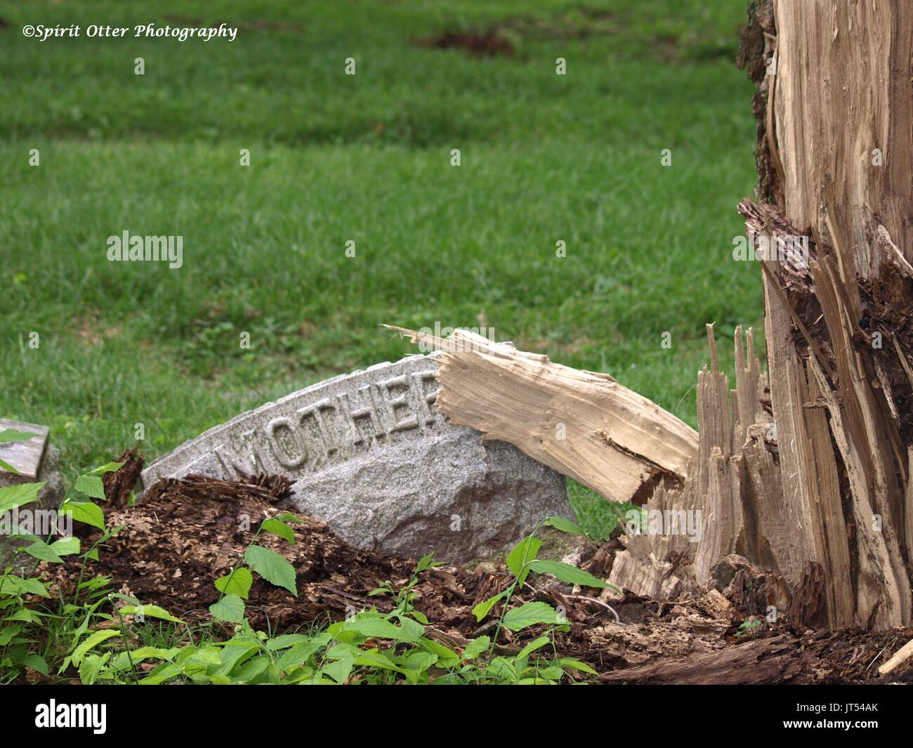 Headstone of a mother ravaged by time, no name shown Stock Photo