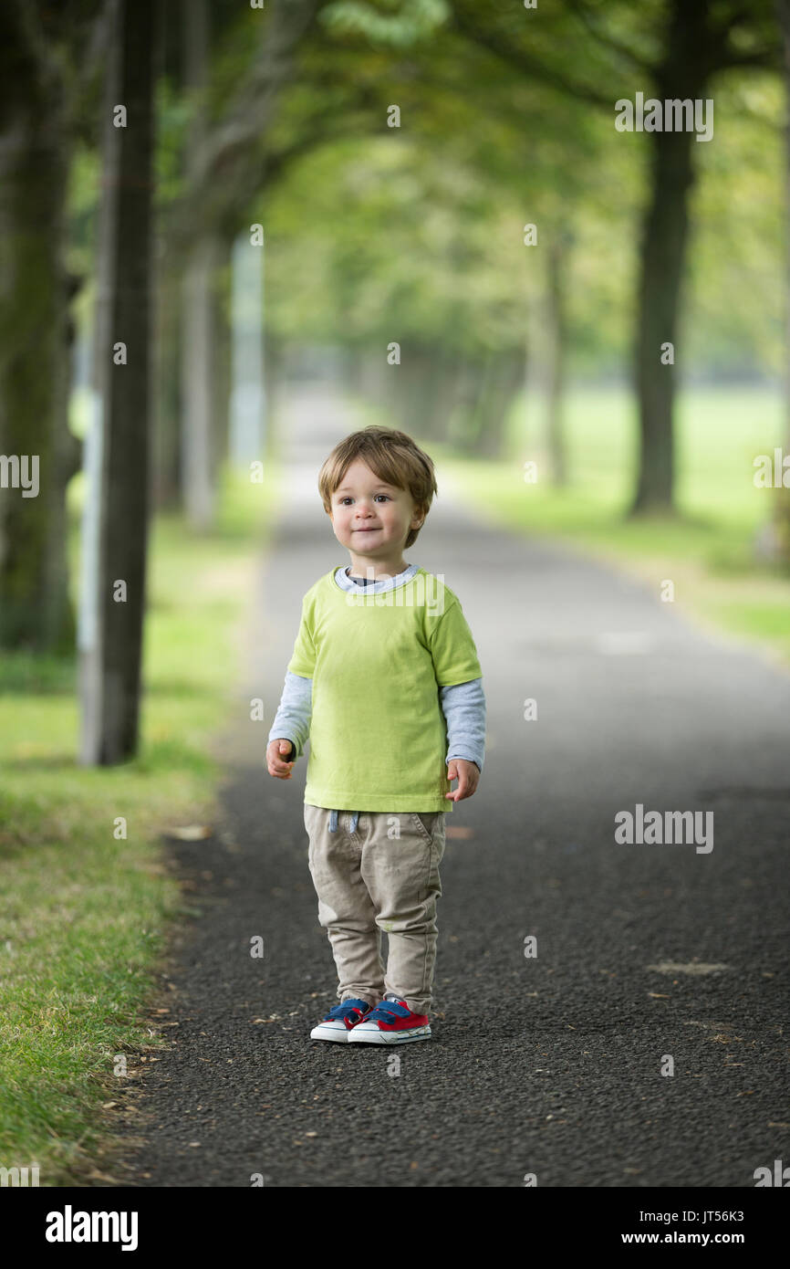 Portrait of a happy young boy outdoors Stock Photo - Alamy