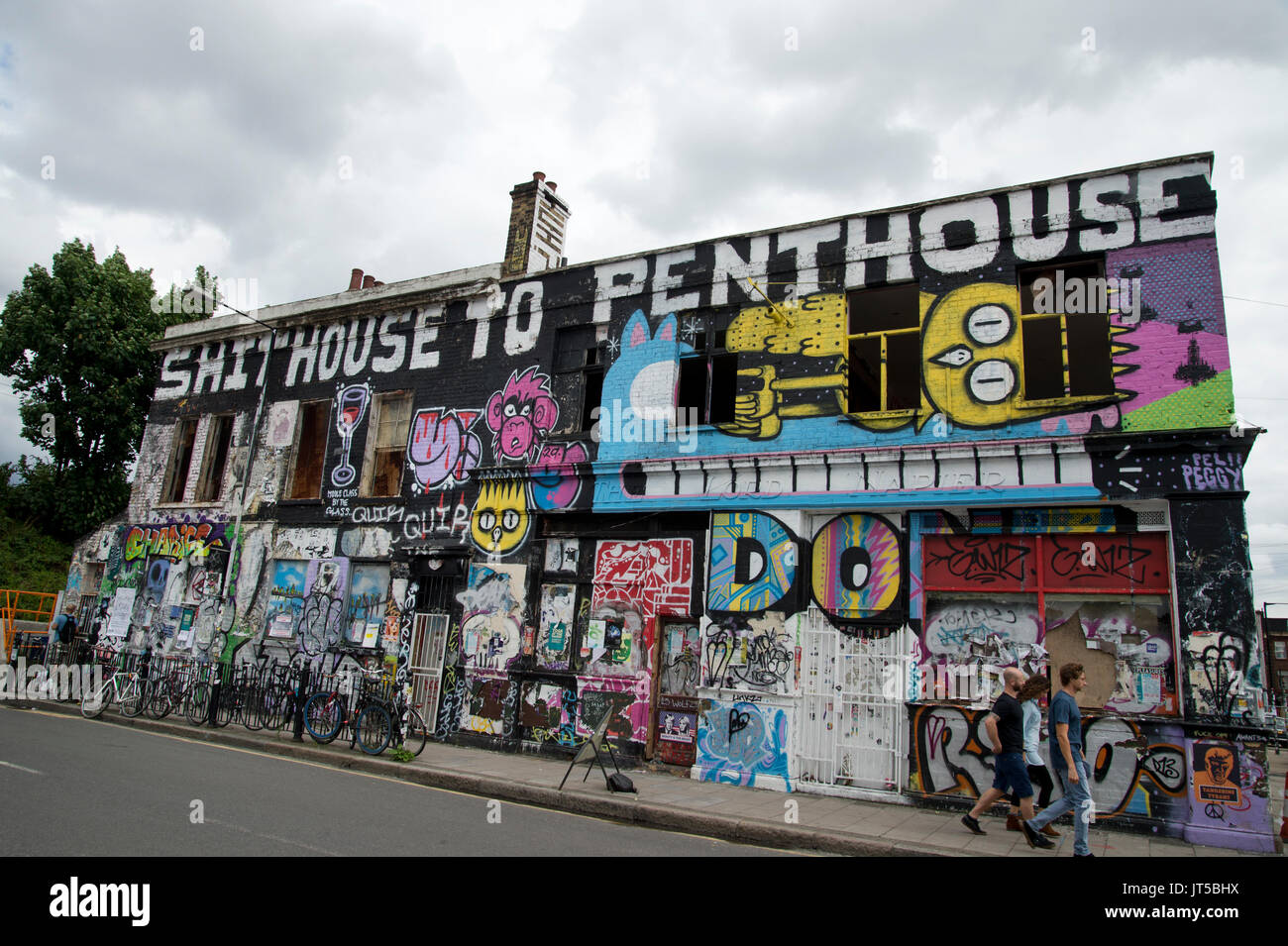 The Lord Napier, a disused pub, covered in graffiti, including the heading ' Shithouse to Penthouse', a comment on the gentrification of the area. Stock Photo