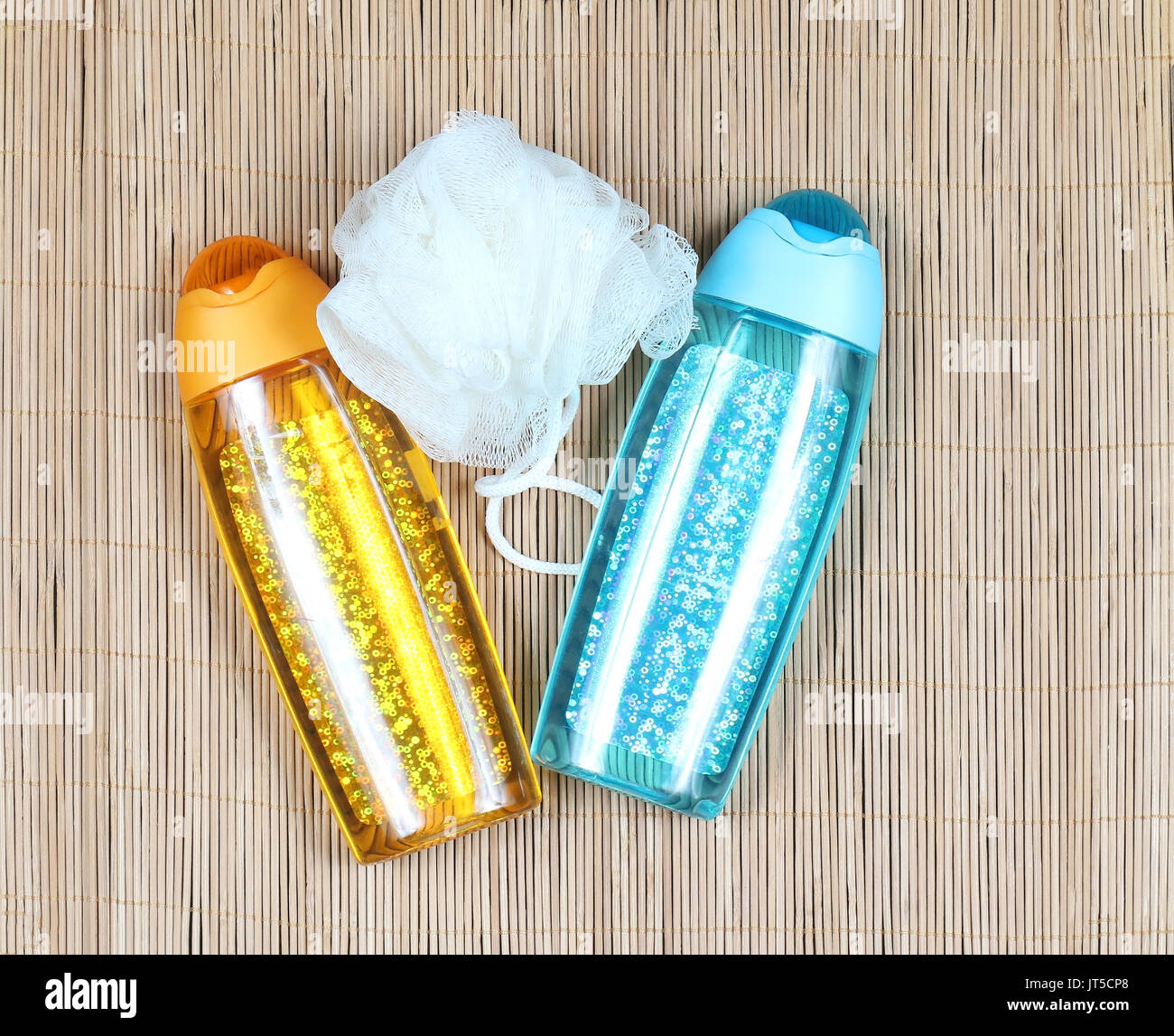 Sparkling shower gel containers with bath sponge Stock Photo Alamy