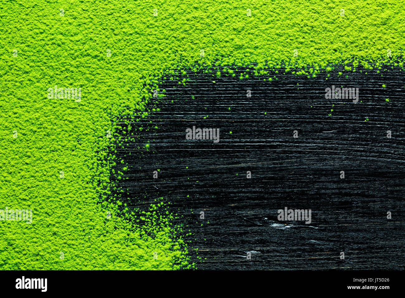 green matcha tea powder on black background, image background, view from above Stock Photo