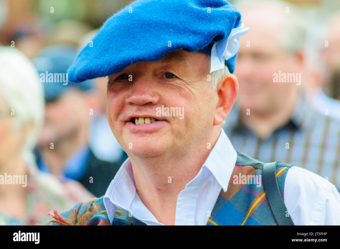 Smiling male wearing a hat celebrates Sma Shot Day in the parade Stock  Photo - Alamy